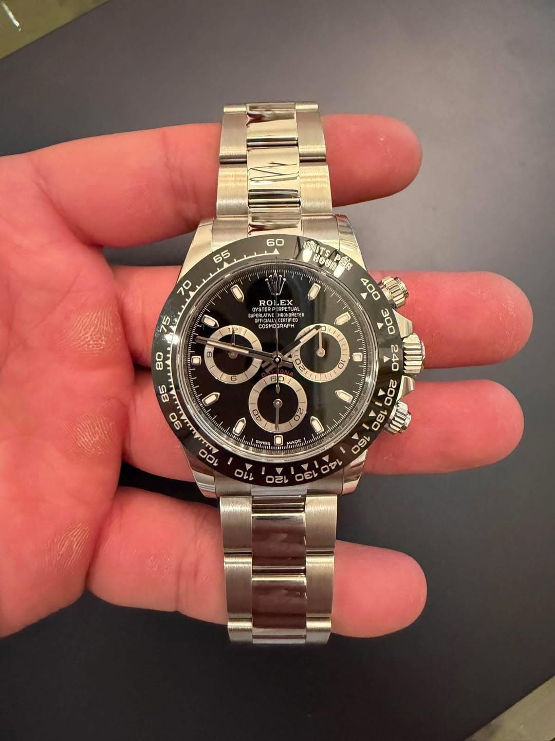 May be an image of wrist watch and text