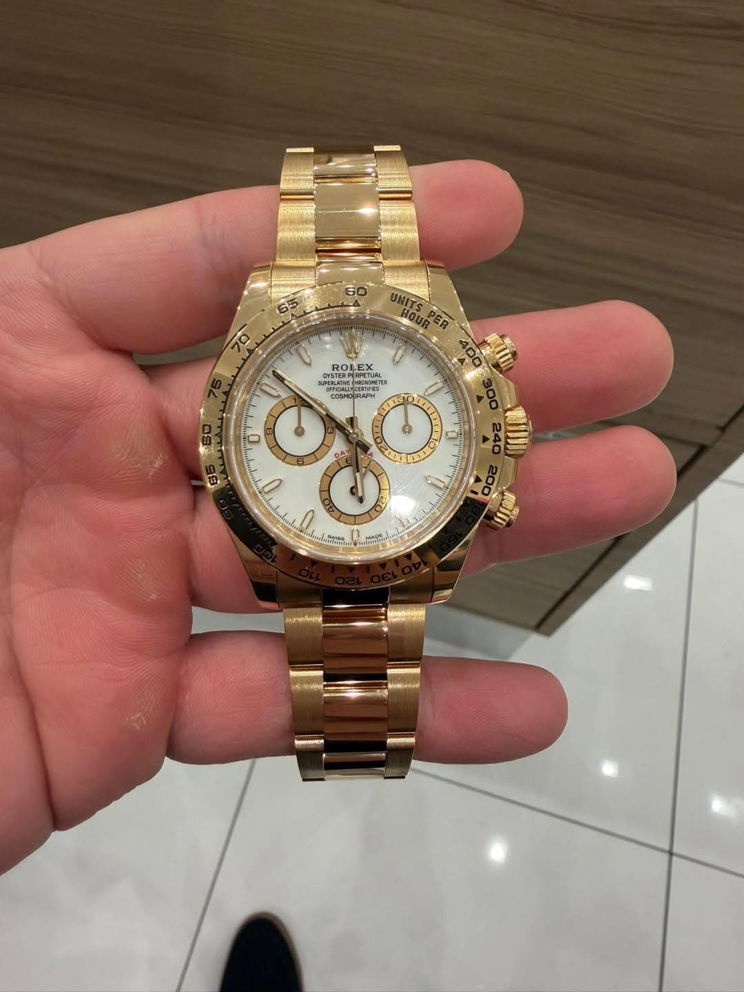 May be an image of wrist watch and text