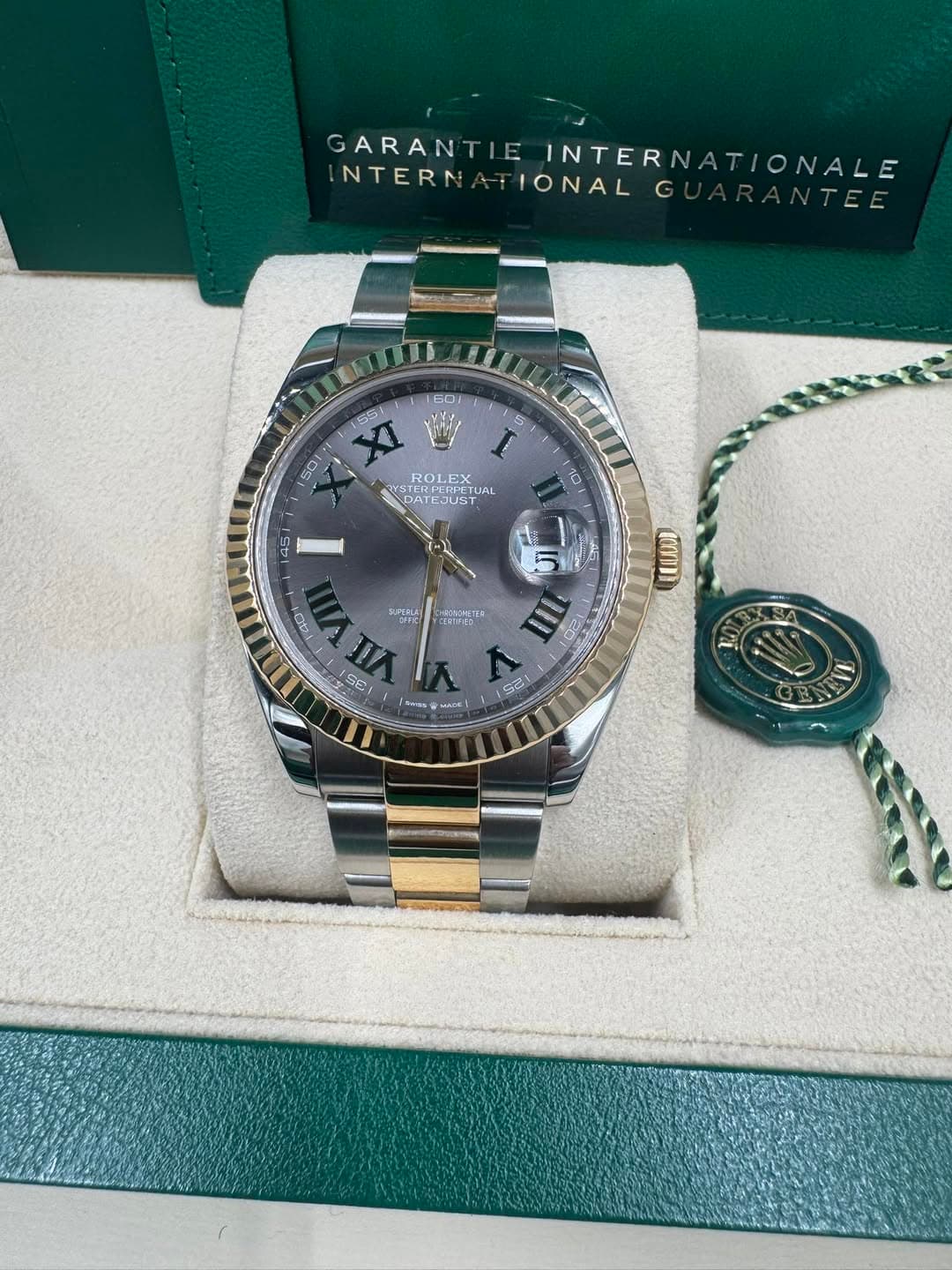 May be an image of wrist watch and text