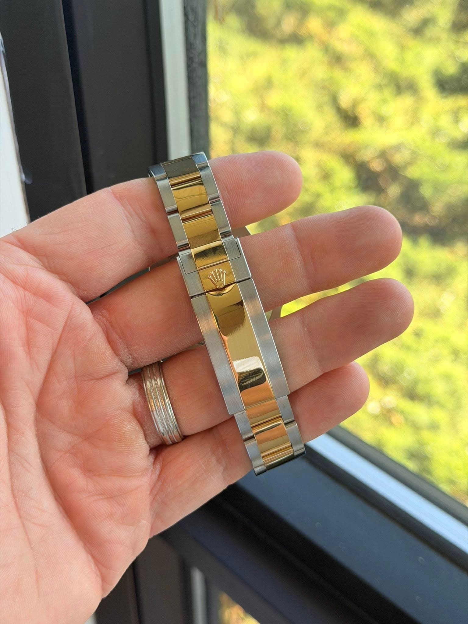 May be an image of jewelry and wrist watch