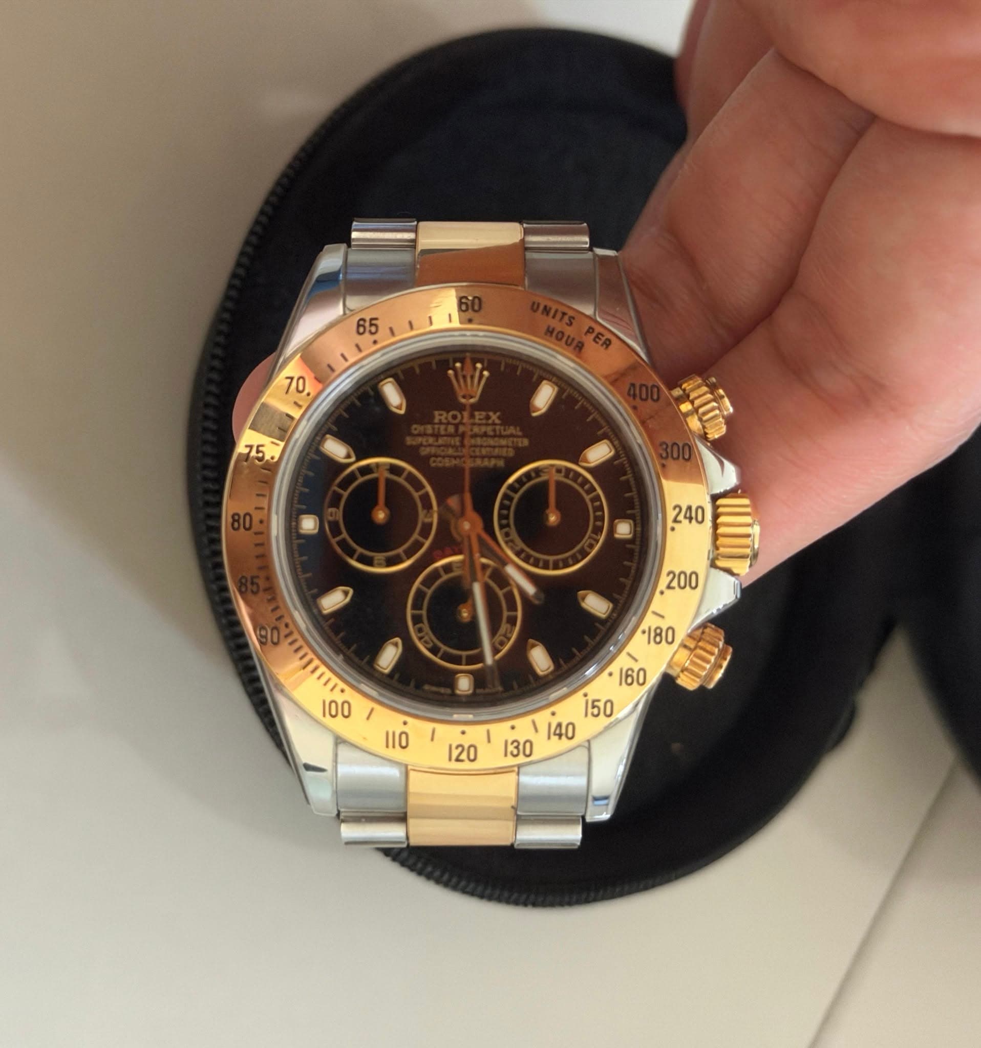 May be an image of wrist watch and text