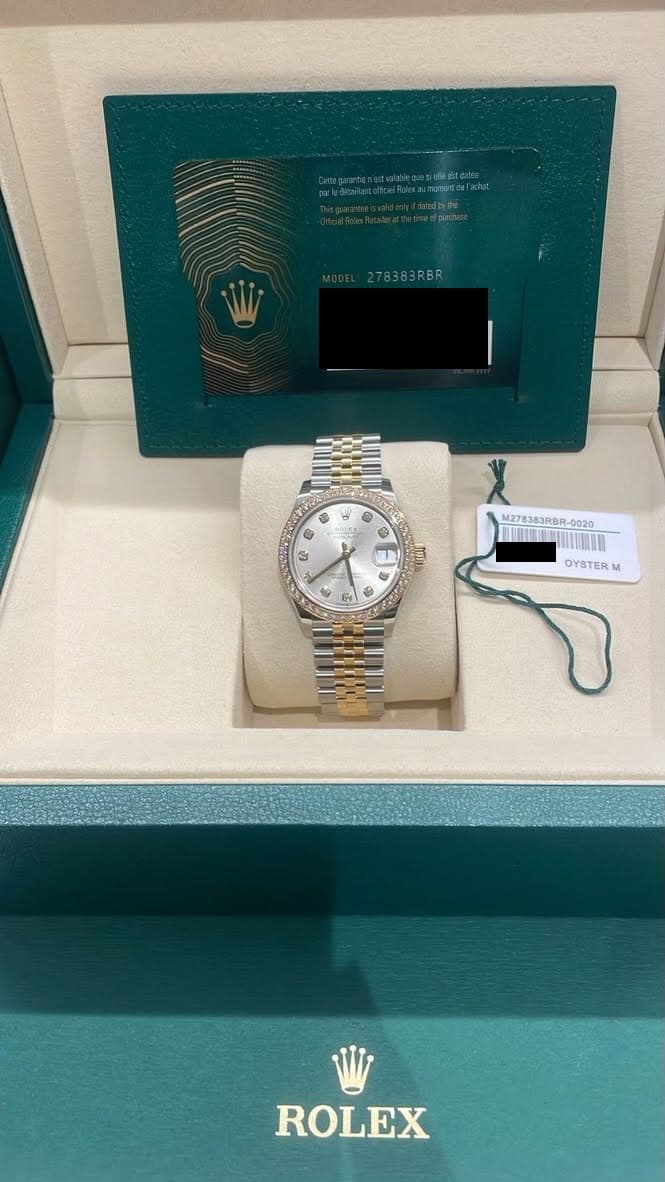 May be an image of wrist watch and text