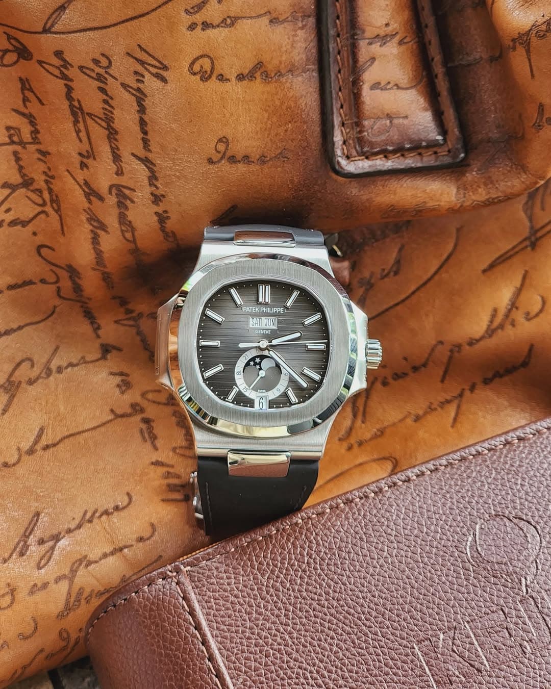 May be an image of wrist watch and text
