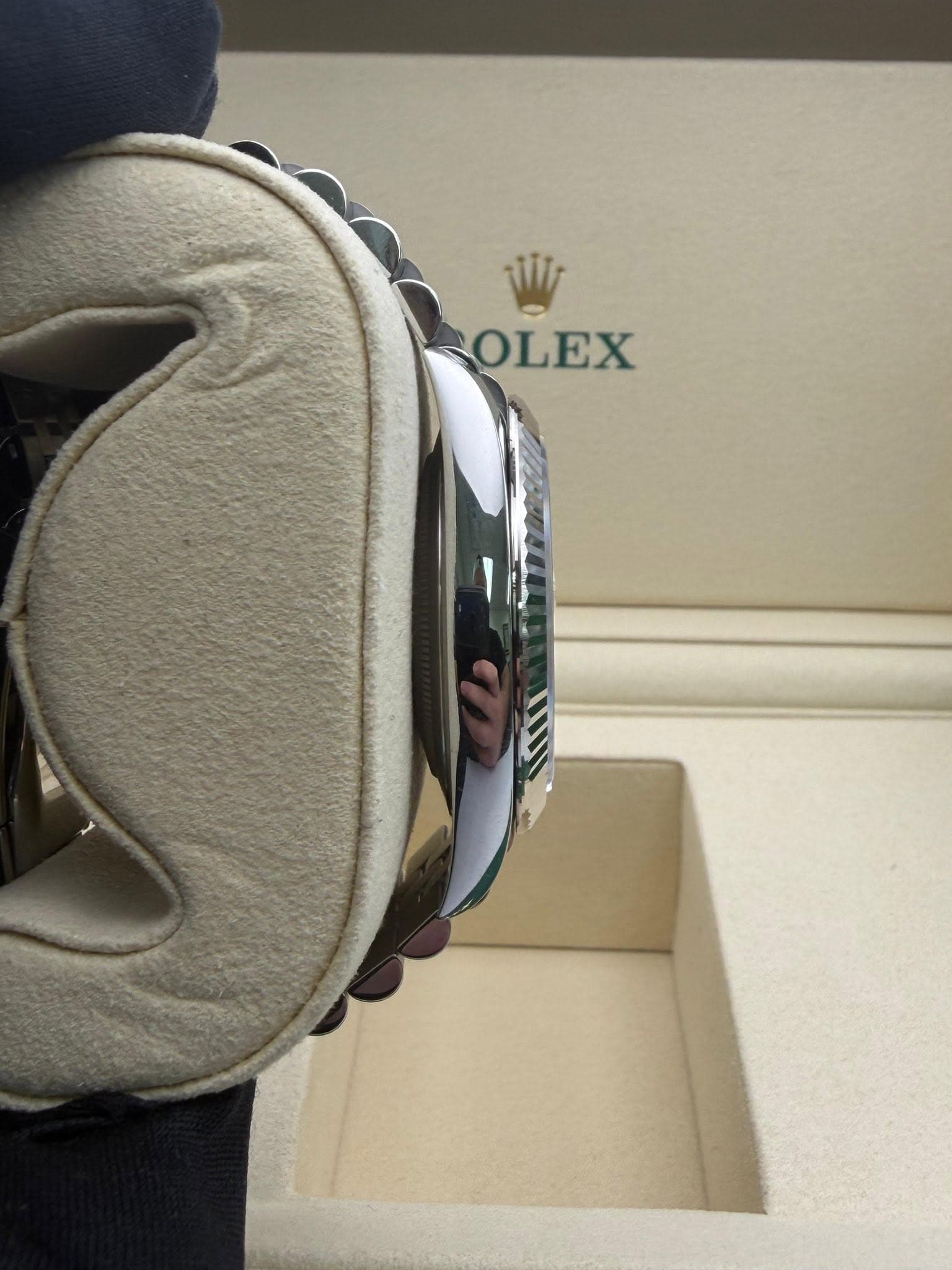 May be an image of wrist watch and text that says 'OLEX'