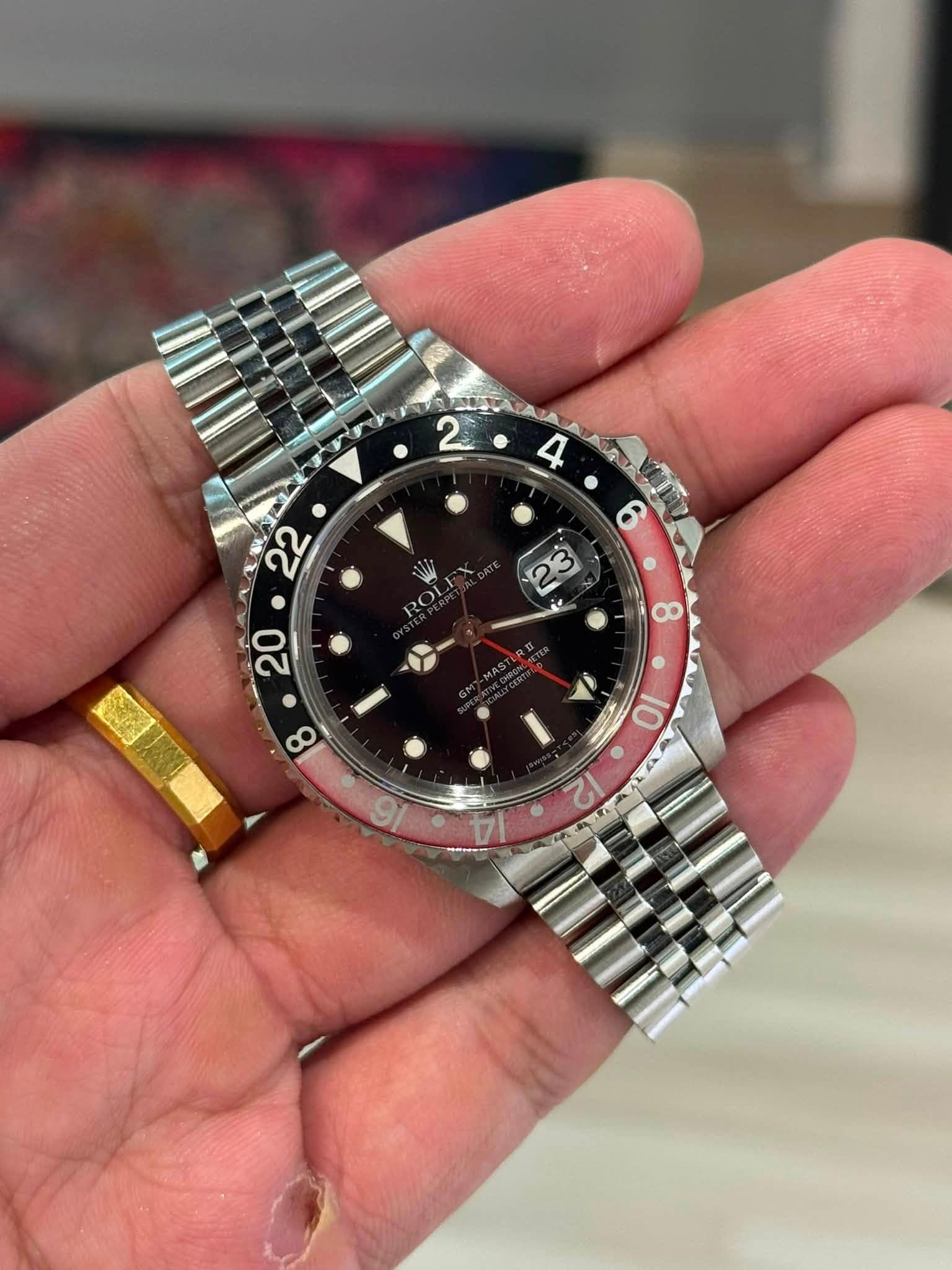 May be an image of wrist watch and text
