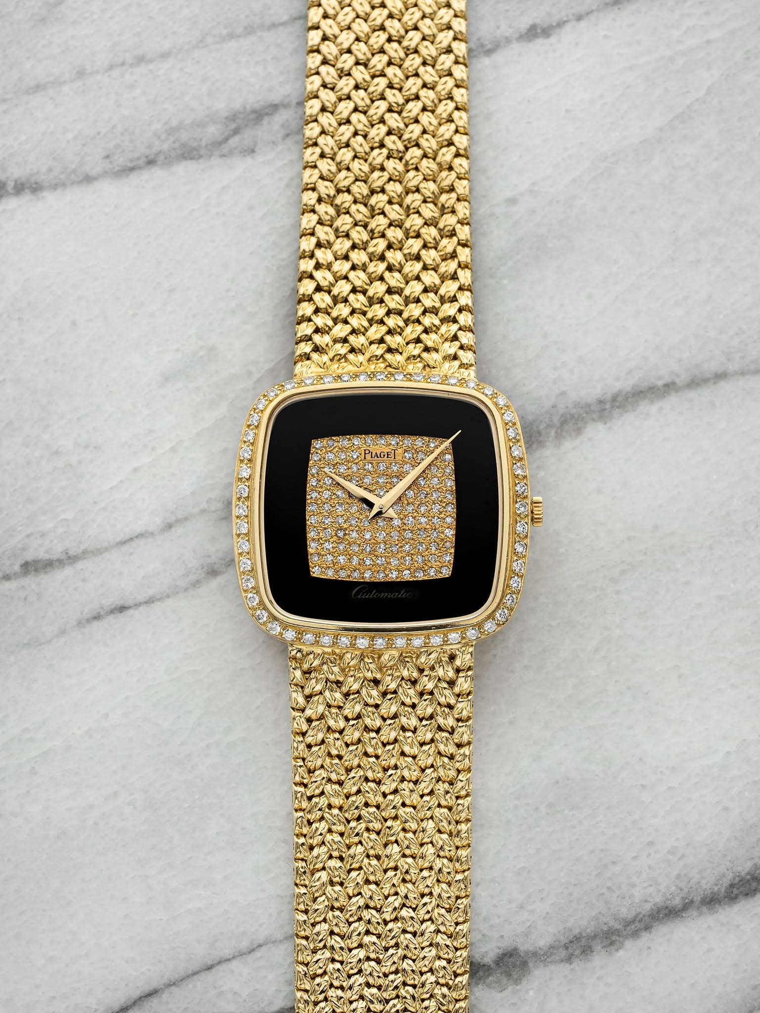 May be an image of jewelry, digital watch and text