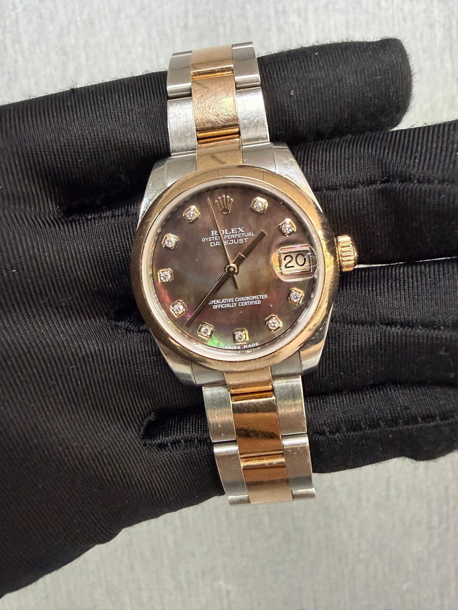 May be an image of wrist watch and text
