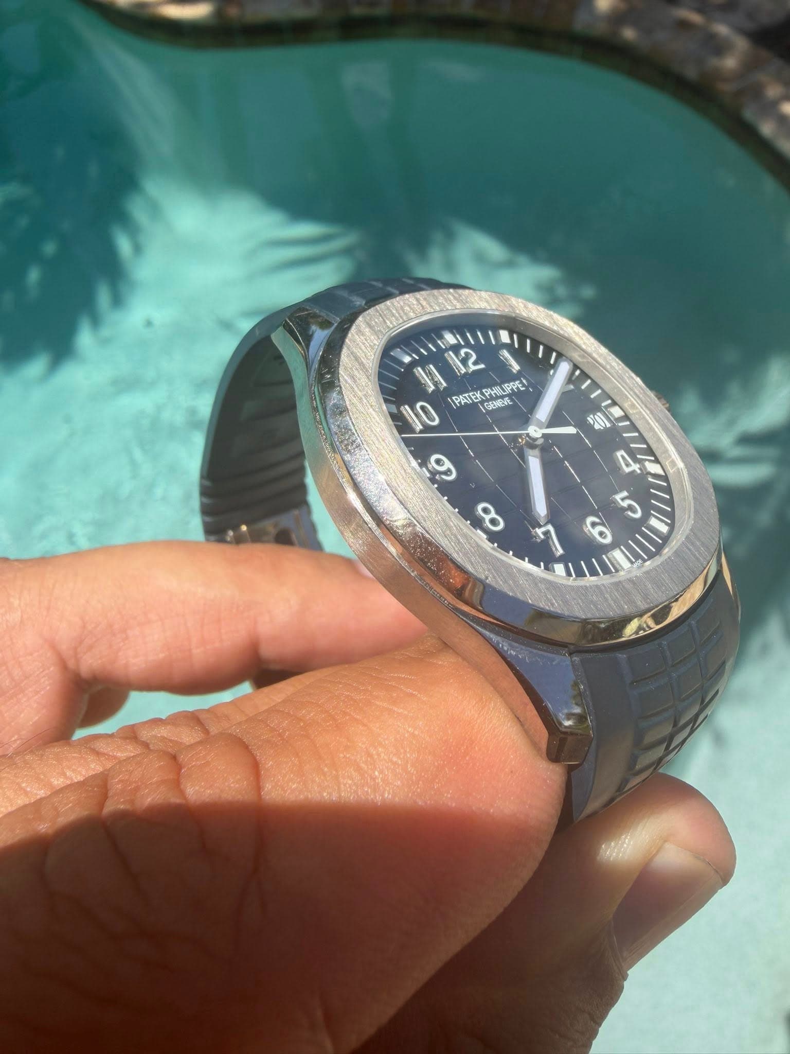 May be an image of wrist watch and text