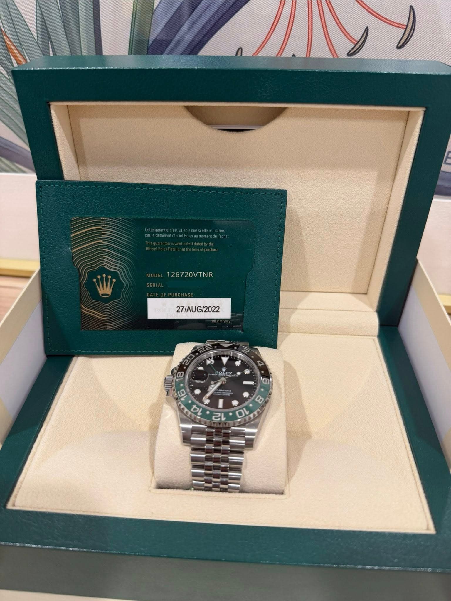 May be an image of wrist watch and text that says '126720VTNR 27/AUG/2022 G/2022 - م T PRlE 6 YO 0 BL 6 E 14 h 己 의 8'