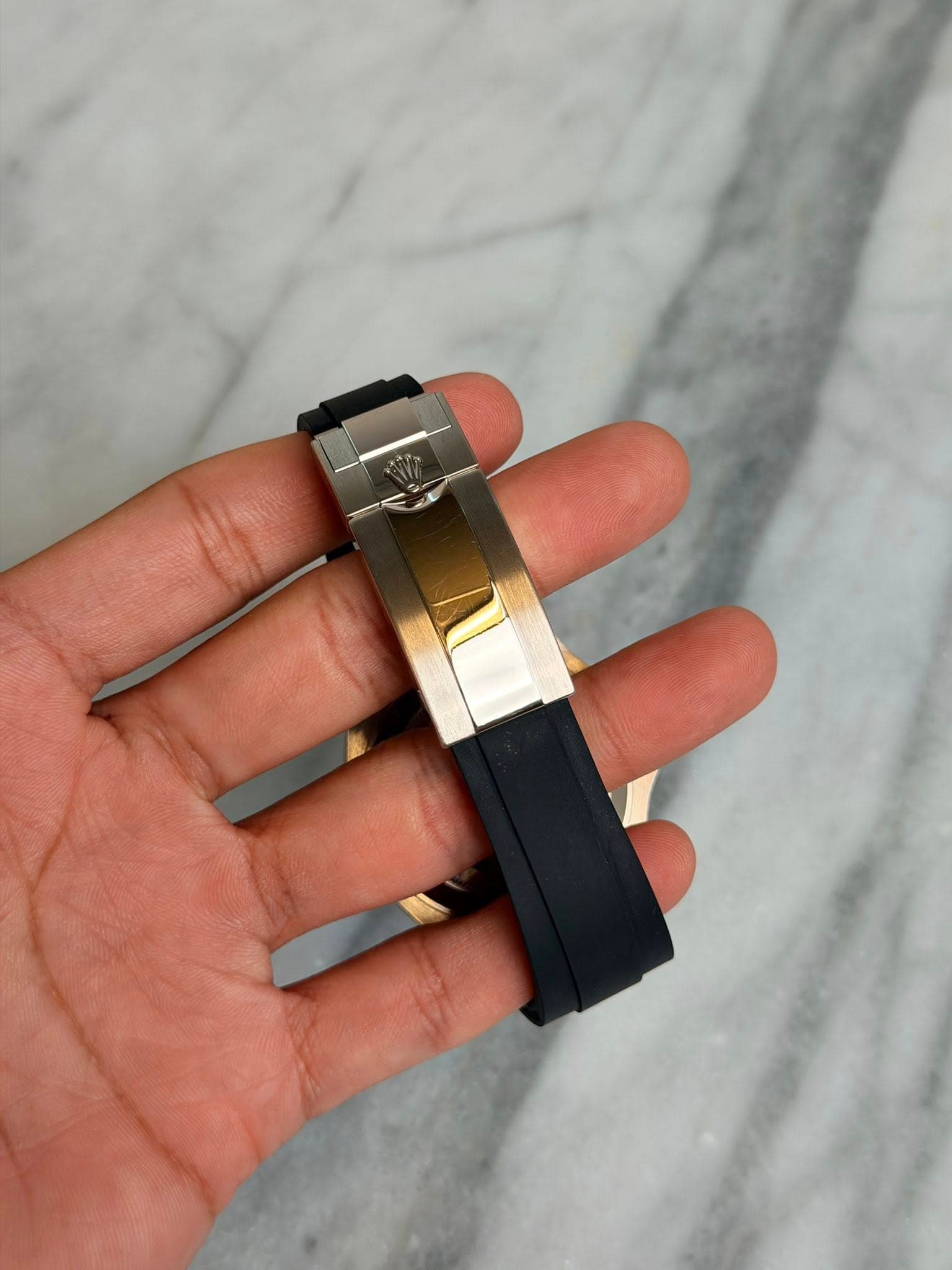May be an image of wrist watch and text