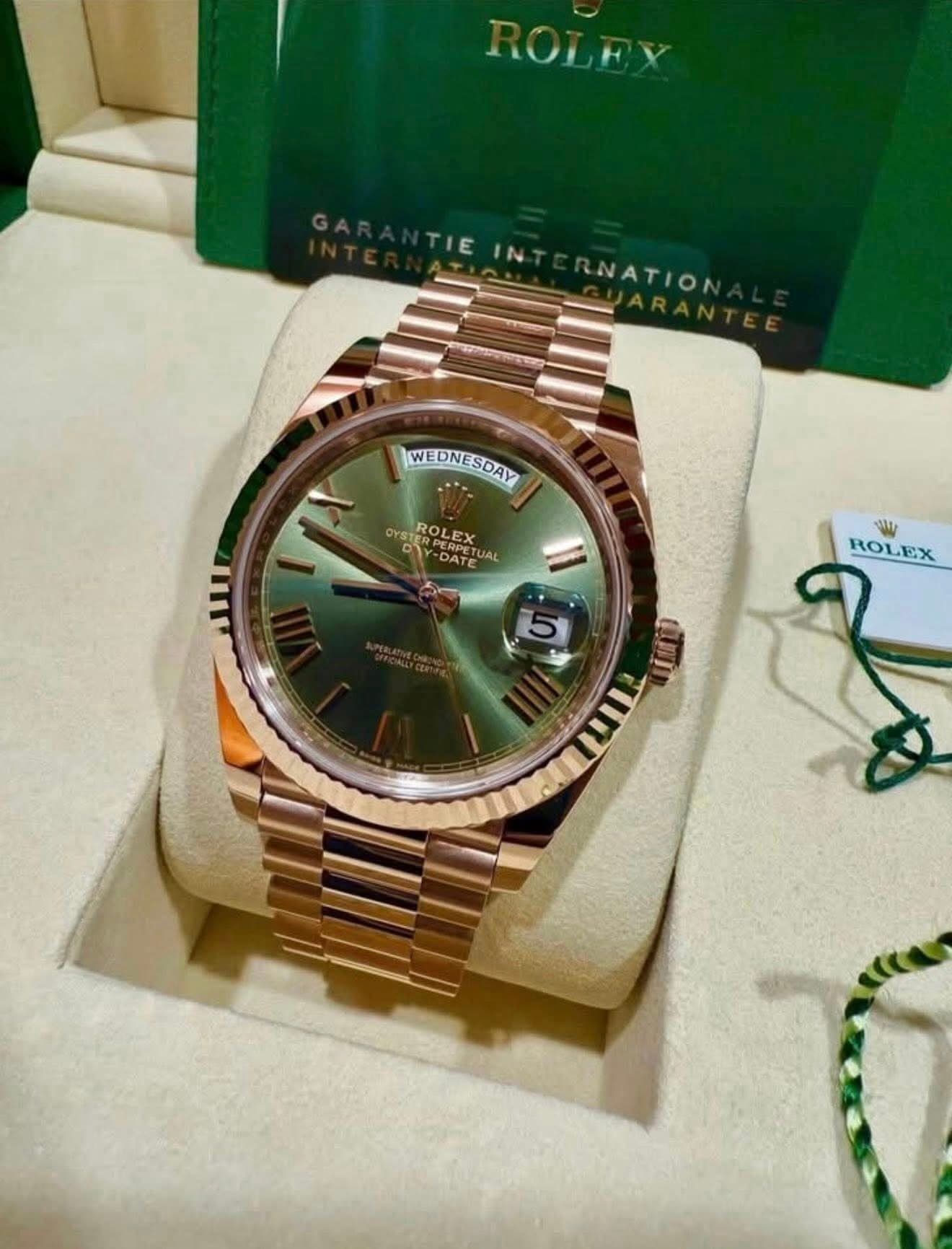 May be an image of wrist watch and text that says 'NATION WEDNESDAY EDNESDAY WE OYST ROLEX PEPIX RPET ATEA JA DY الا SI ROLEX'