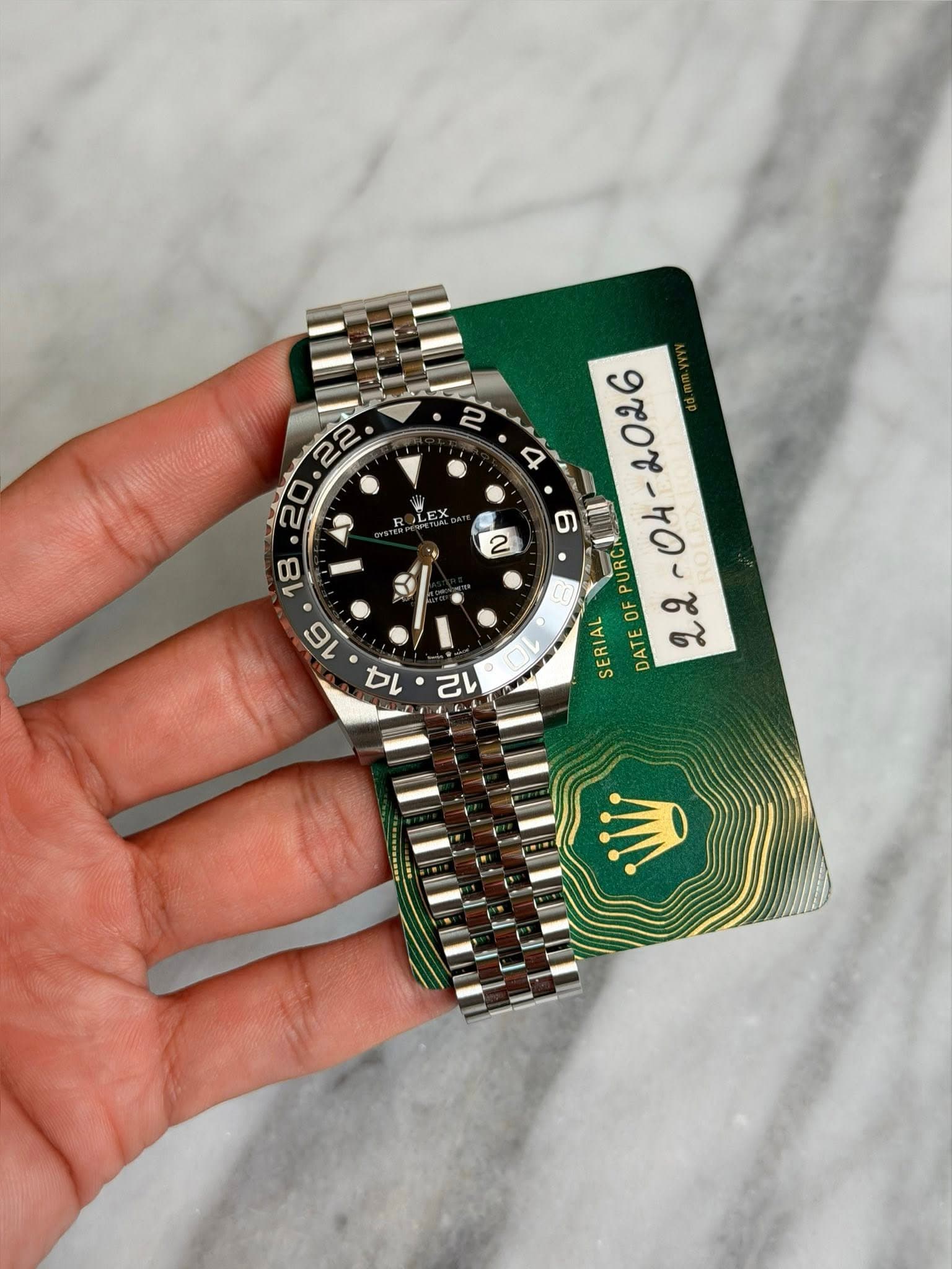 May be an image of wrist watch and text that says 'ល LEX DL & イ RCAI PURC OF SERIAL DATE 22 己い'