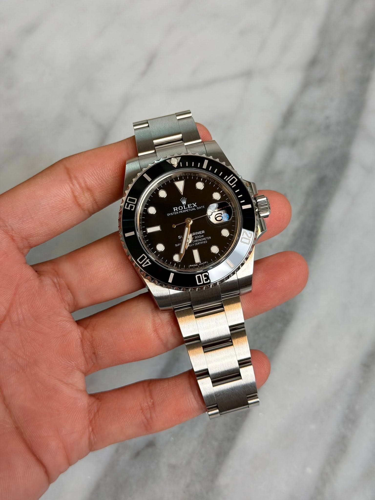 May be an image of wrist watch and text that says '10 50 מאי ROLEX 00'