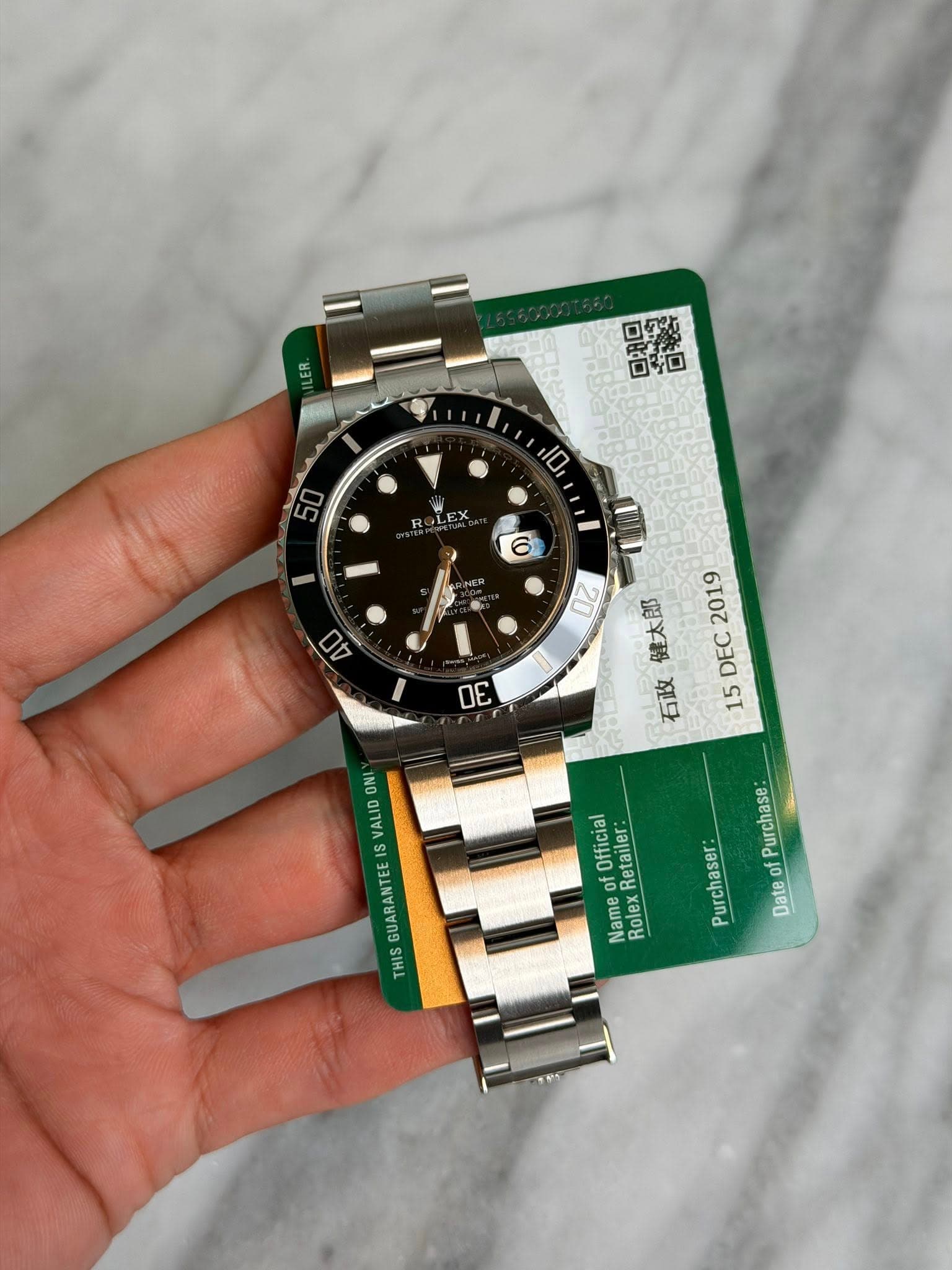 May be an image of wrist watch and text that says '口然 ፪ዲታ 日拍 扣 D 10 6 DA OZ σε 健太郎 2019 DEC ROLE 石政 15 INO Official ဆ Retailer of Name Rolex Purchase Purchaser of Date THIS'