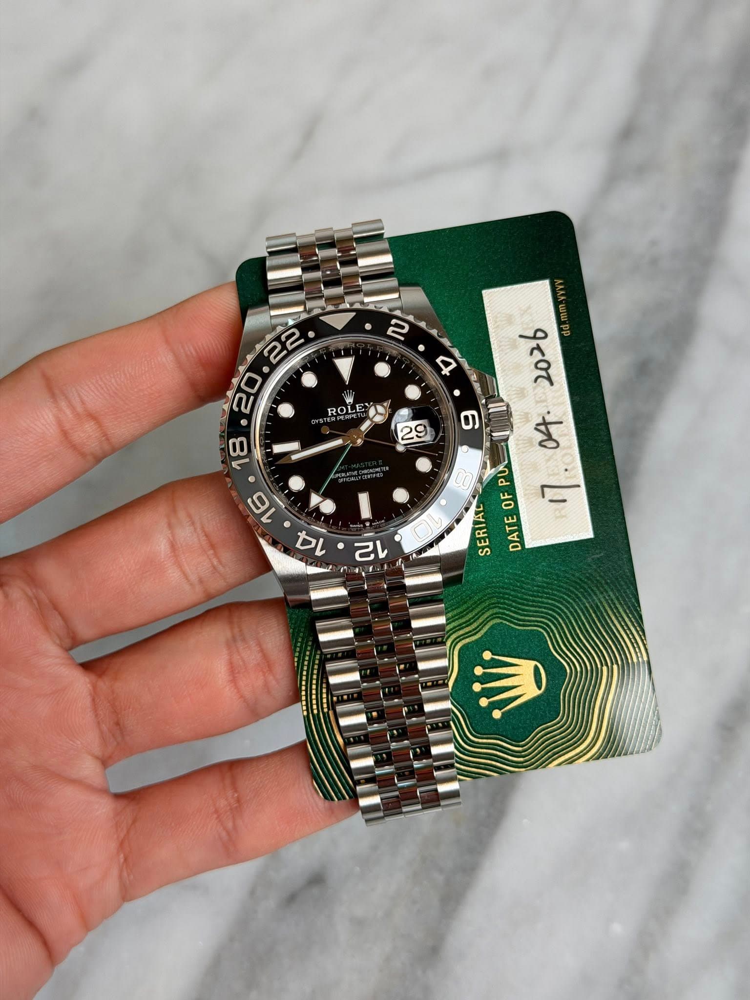 May be an image of wrist watch and text that says ' ROLE ዕረ 2026 04 PU SERIAL OF DATE 己'