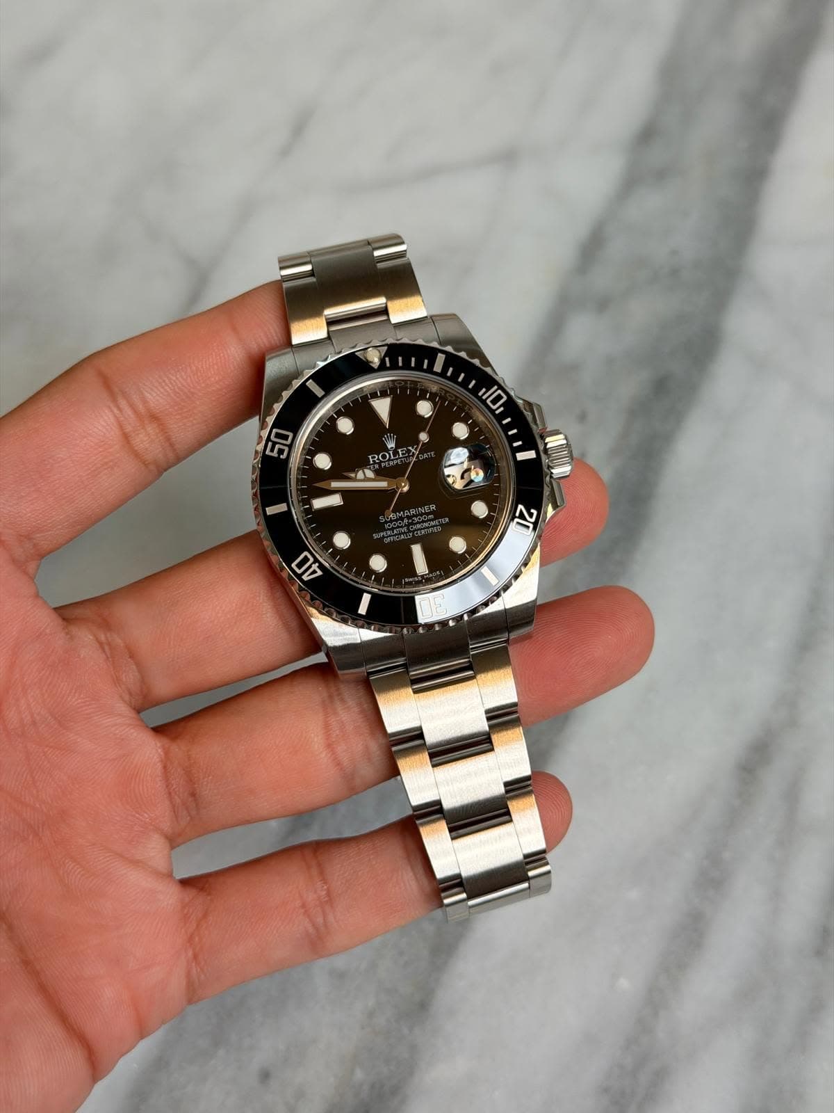 May be an image of wrist watch and text that says '10, 50 0 ROLE X 番界 - 22 በክ'