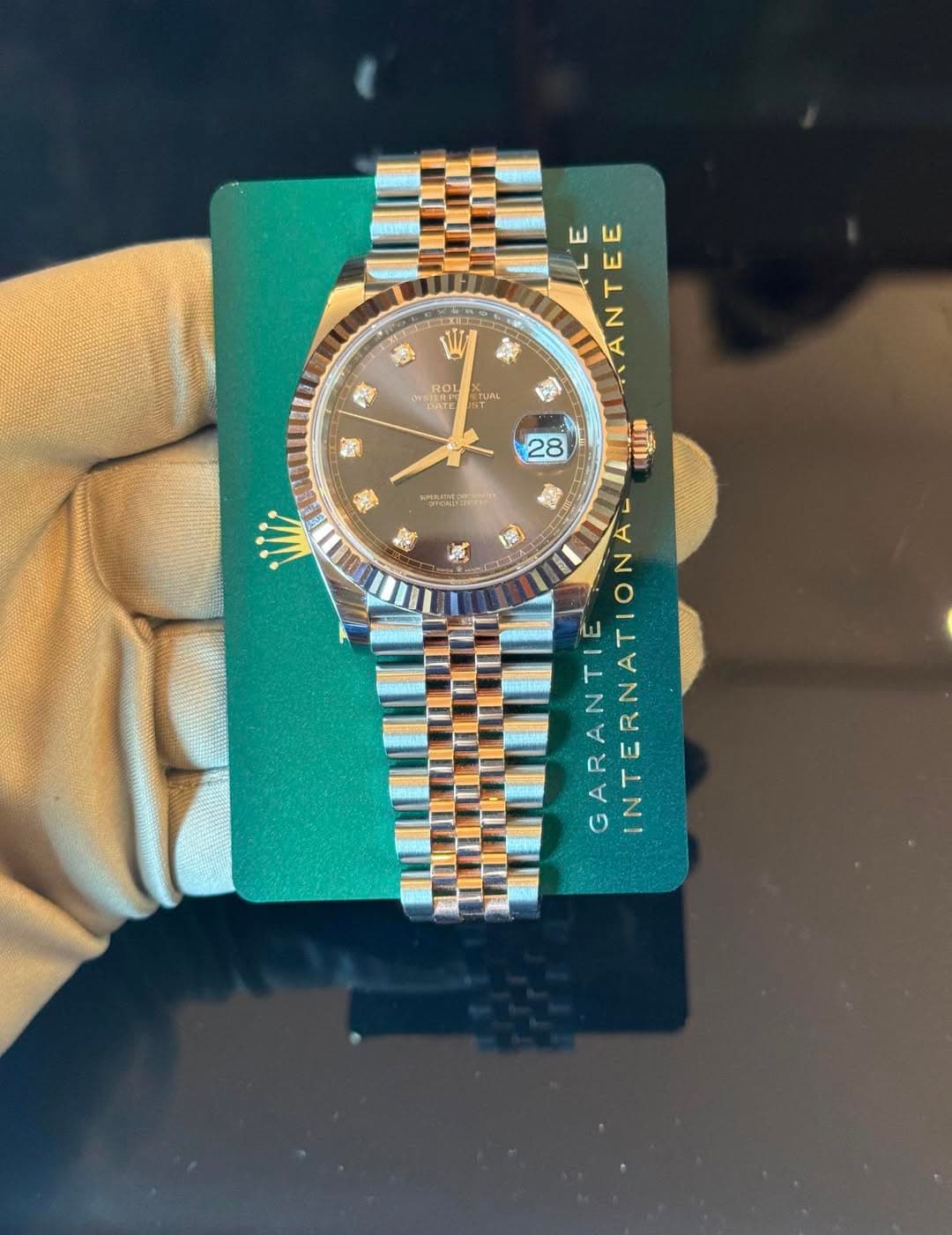 May be an image of wrist watch and text