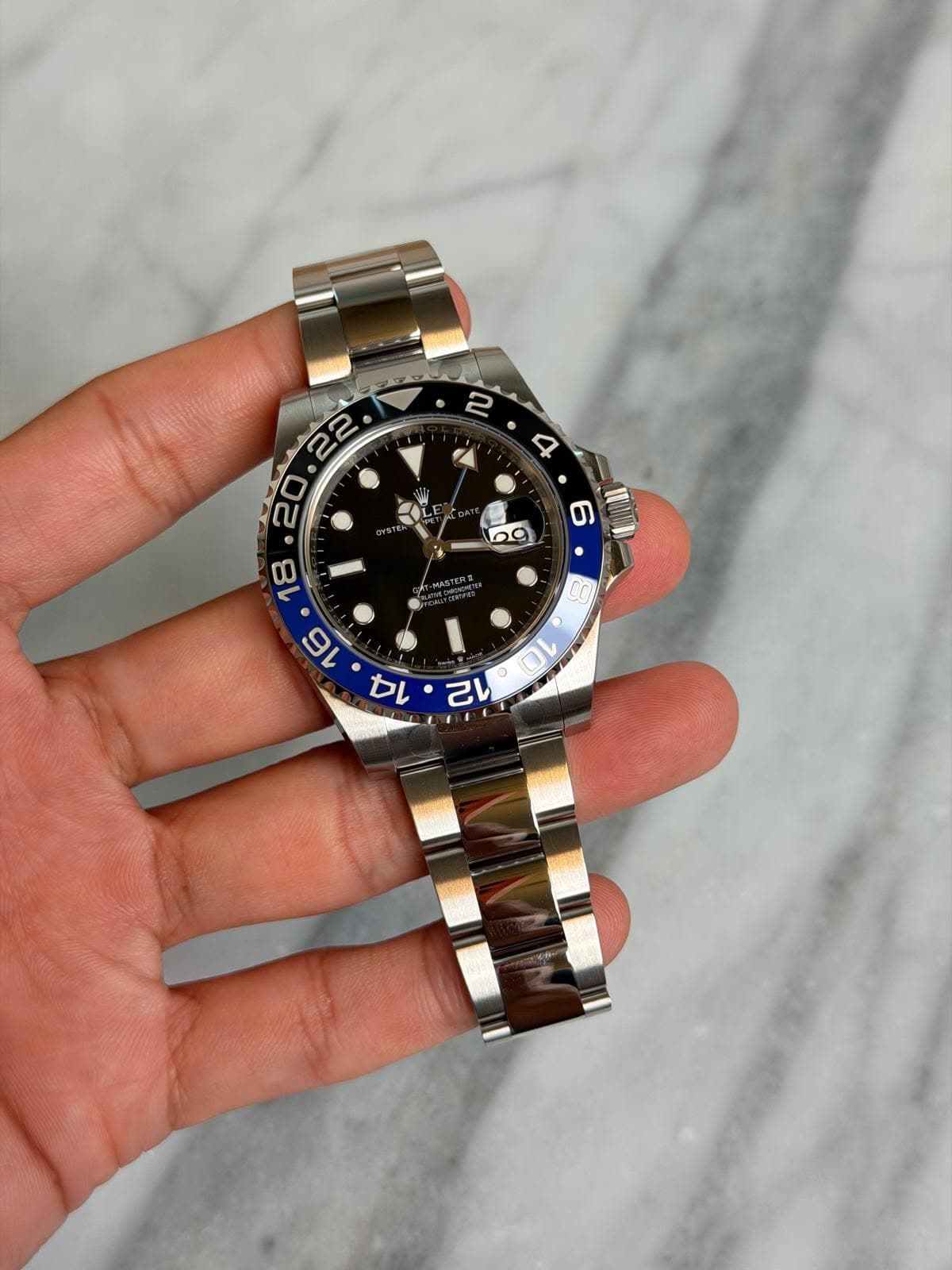 May be an image of wrist watch and text