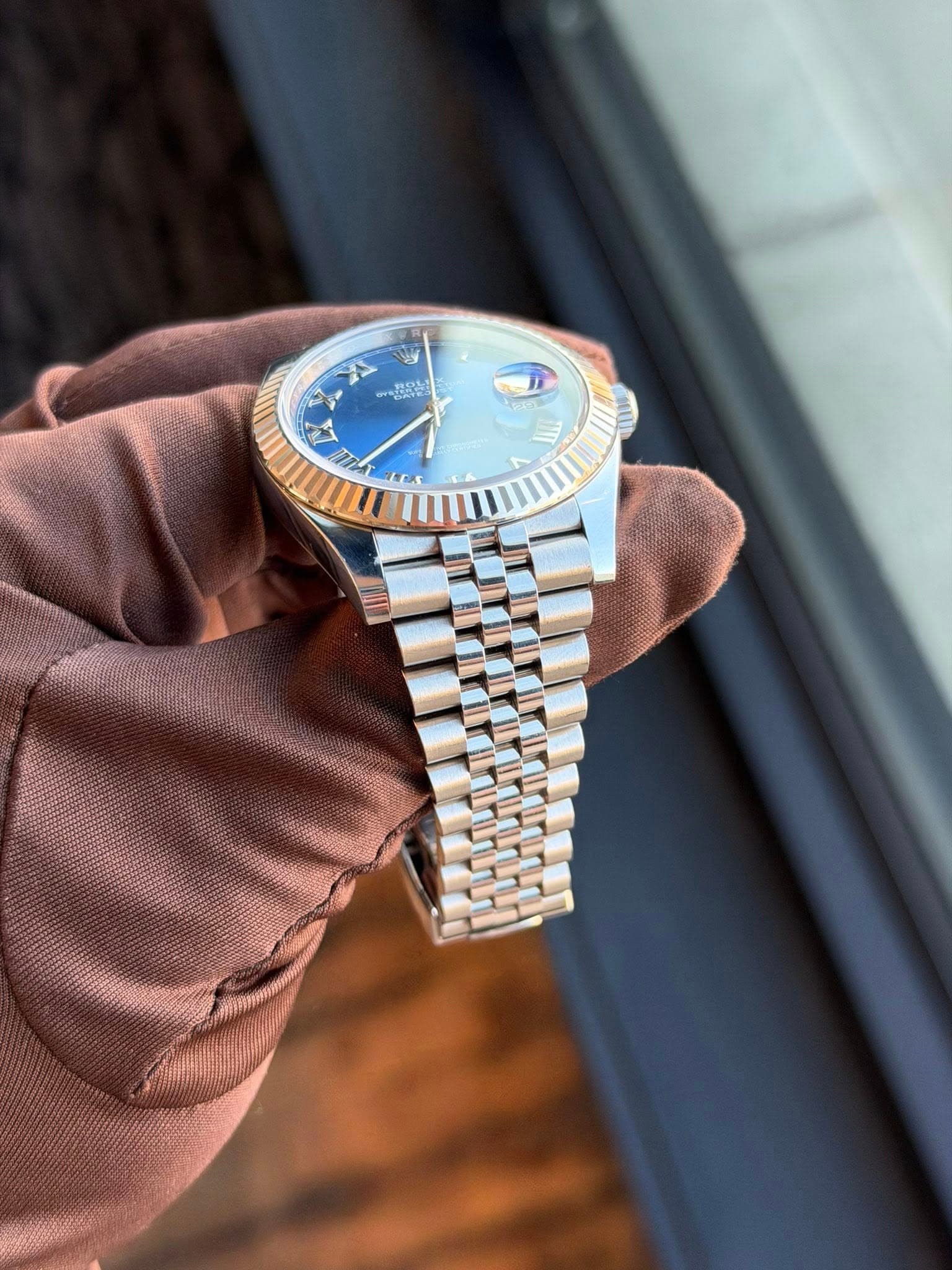 May be an image of wrist watch and text