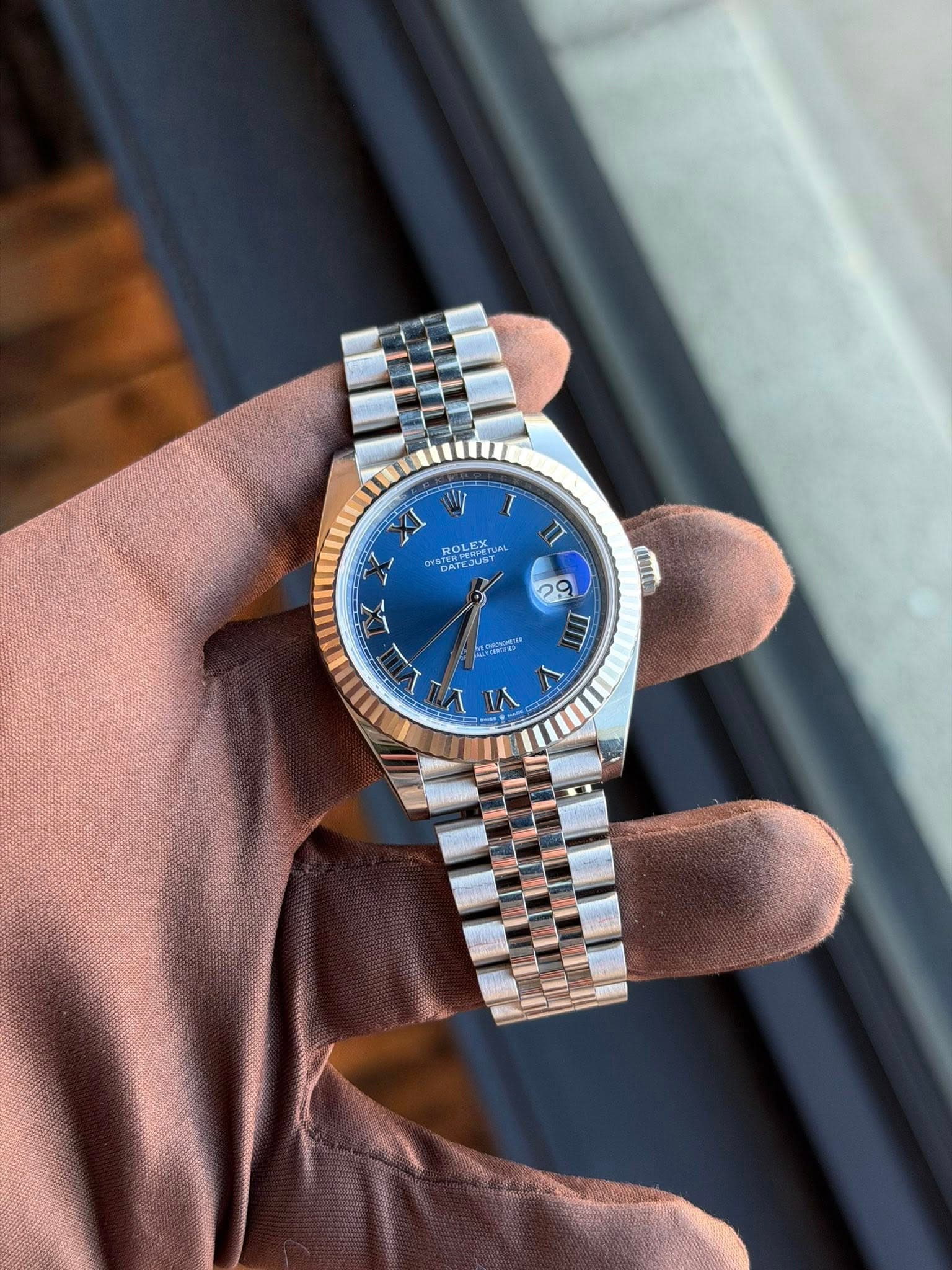 May be an image of wrist watch and text