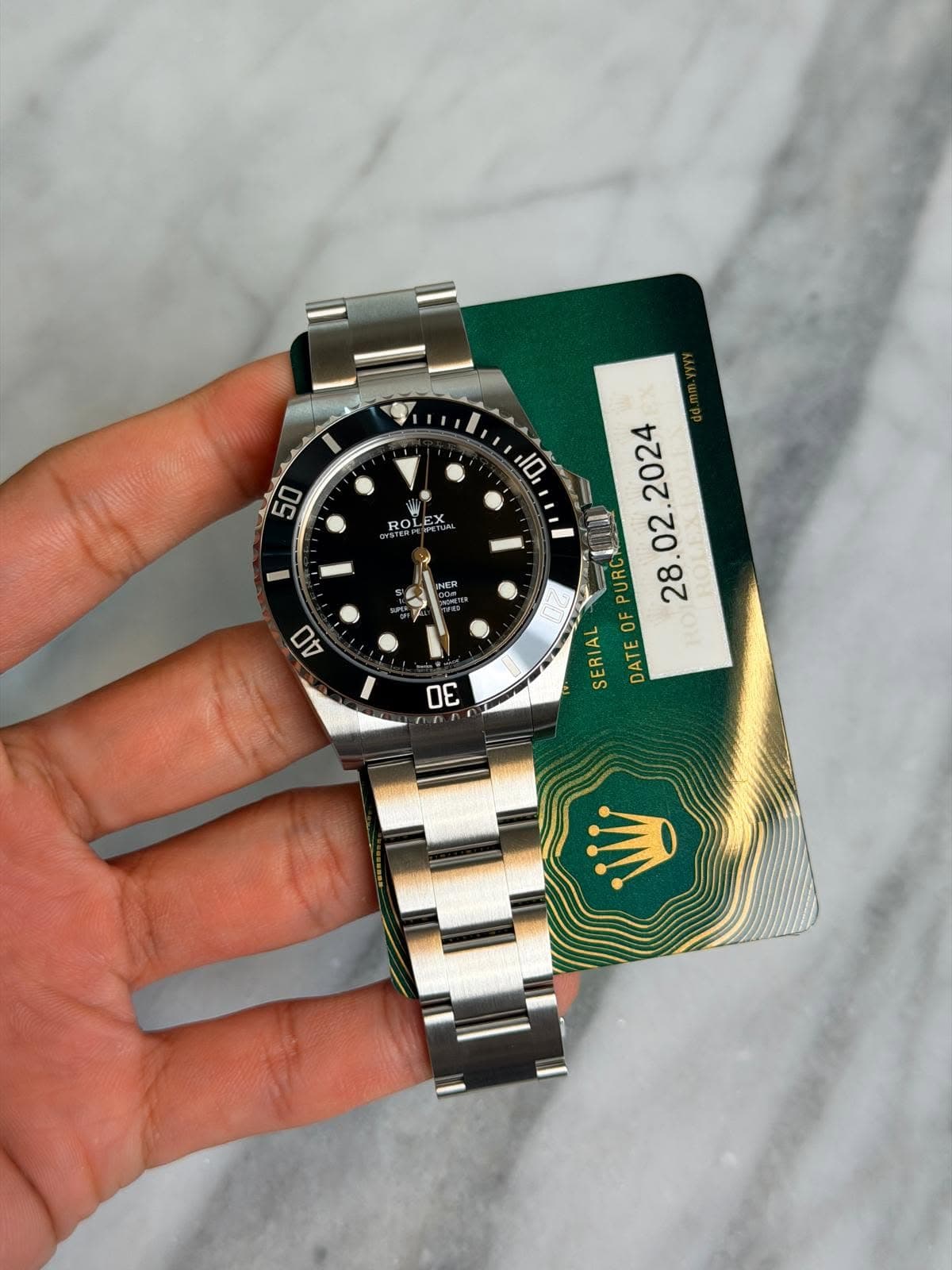 May be an image of wrist watch and text that says '10 50 RO PURC OF SERIAL DATE RO'