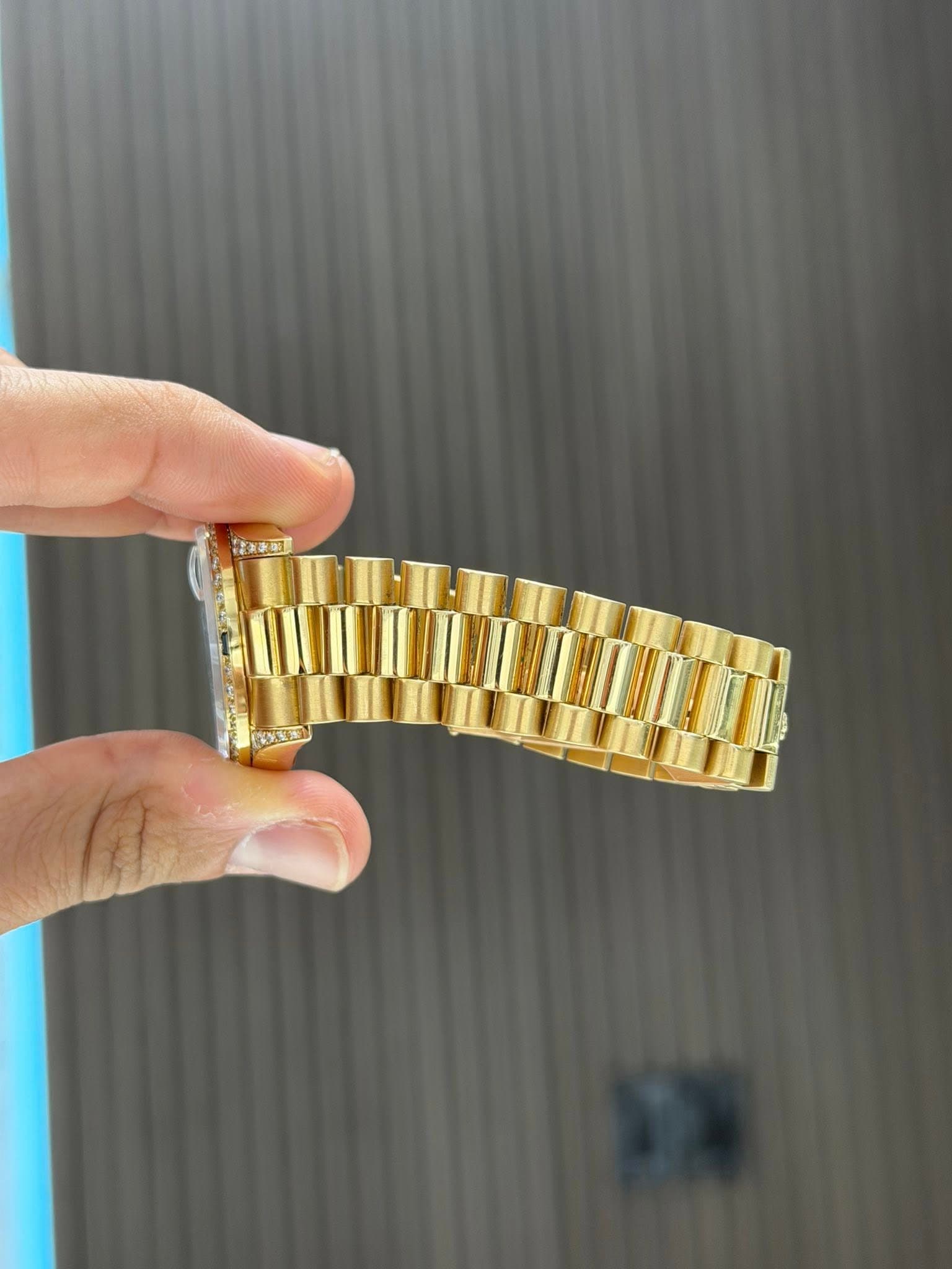 May be an image of wrist watch and text