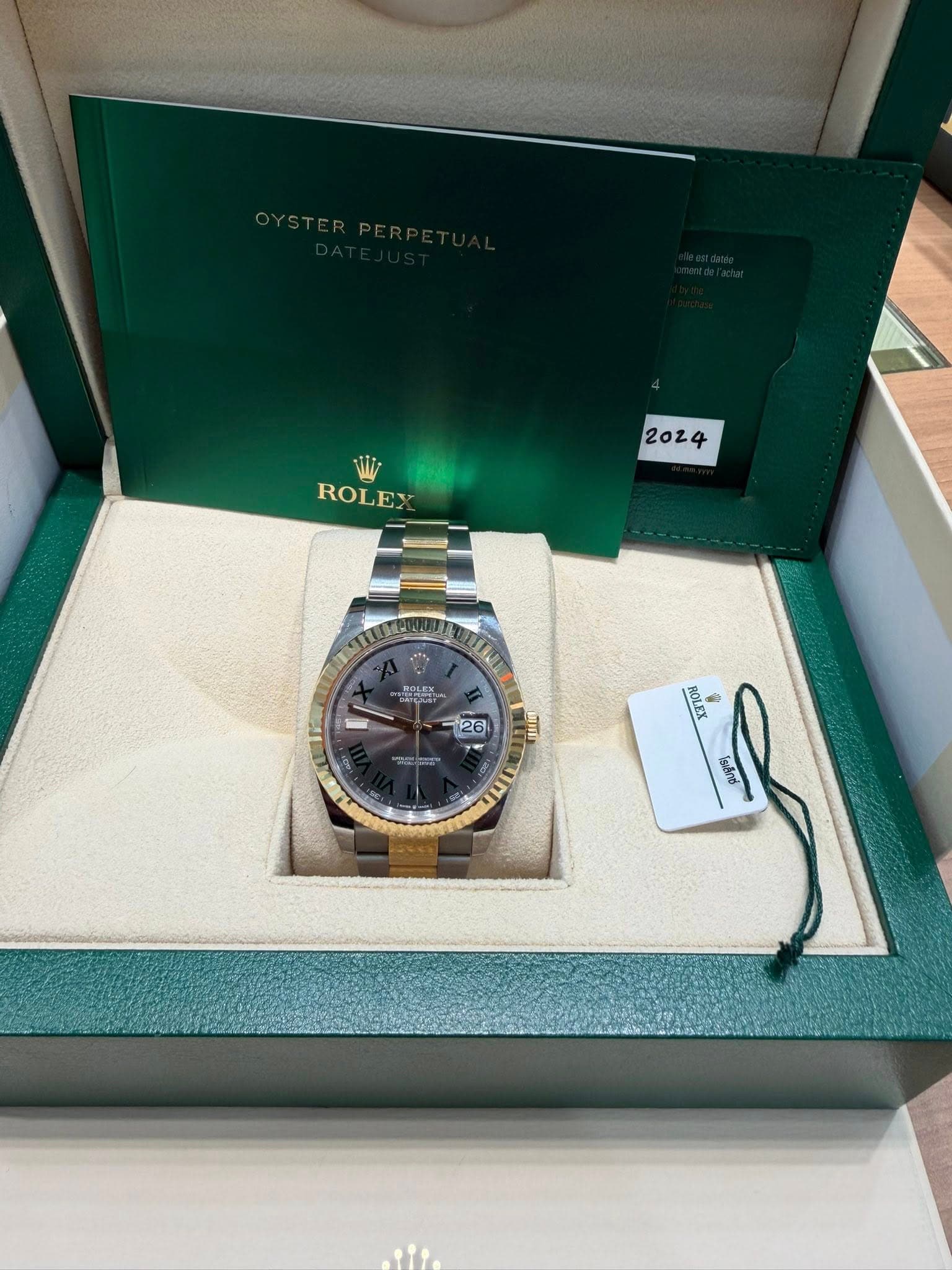 May be an image of wrist watch and text