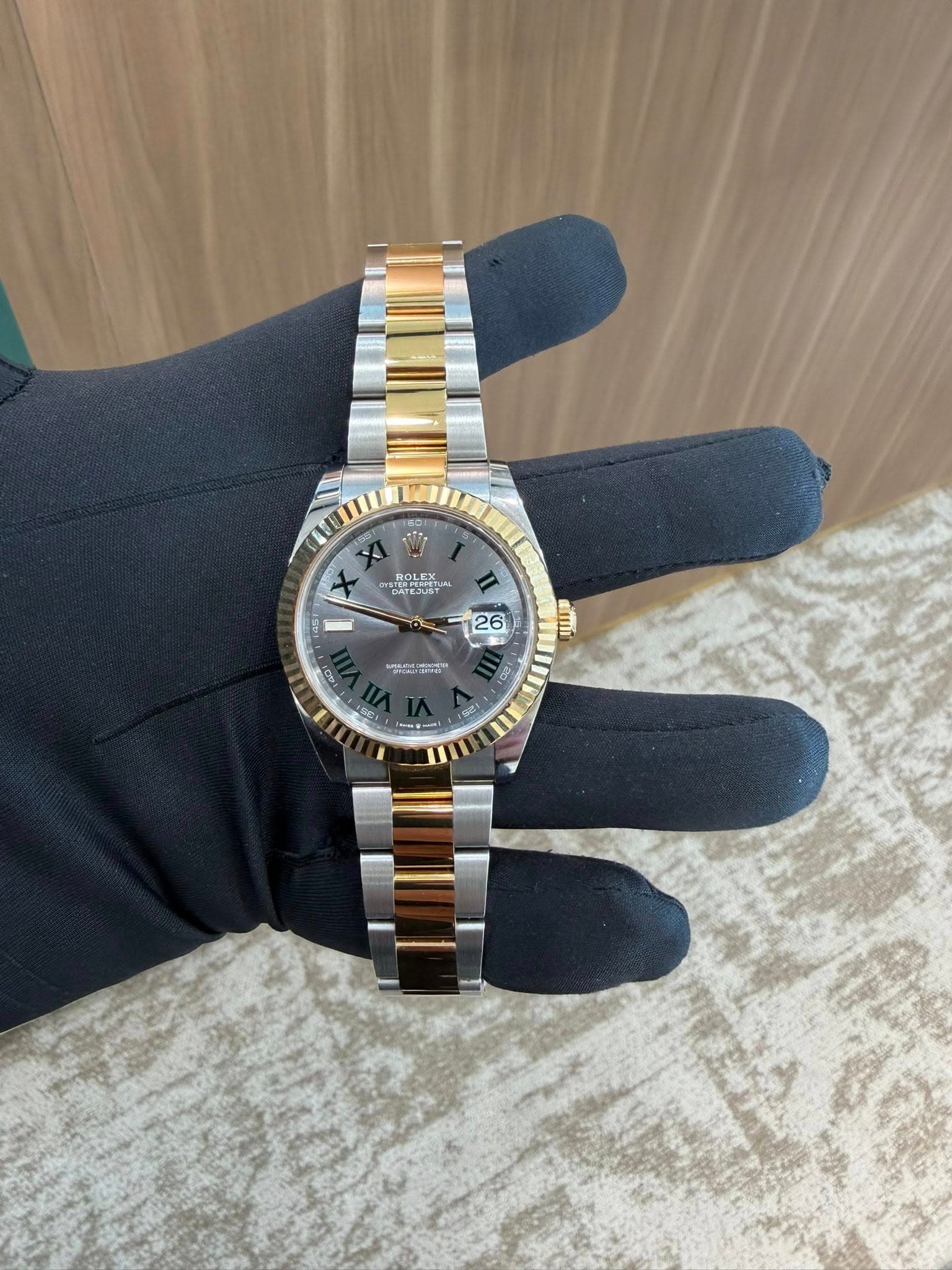 May be an image of wrist watch and text