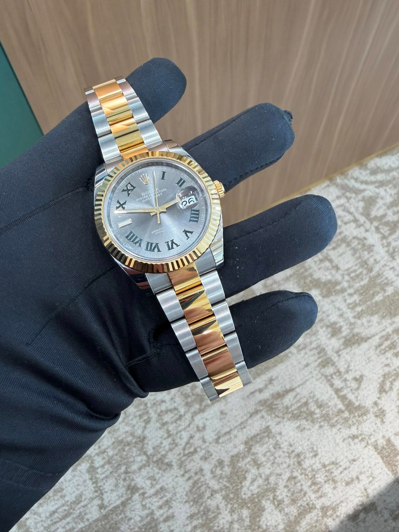 May be an image of wrist watch and text