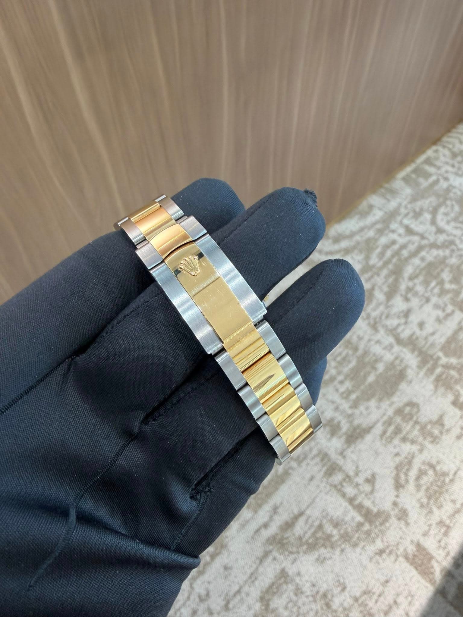 May be an image of wrist watch and jewelry