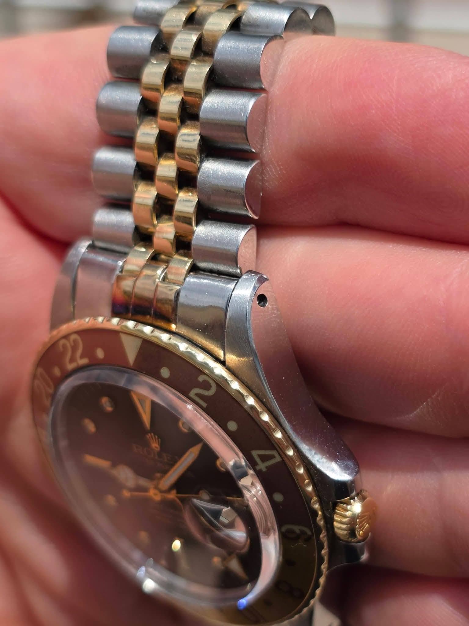May be an image of wrist watch and text