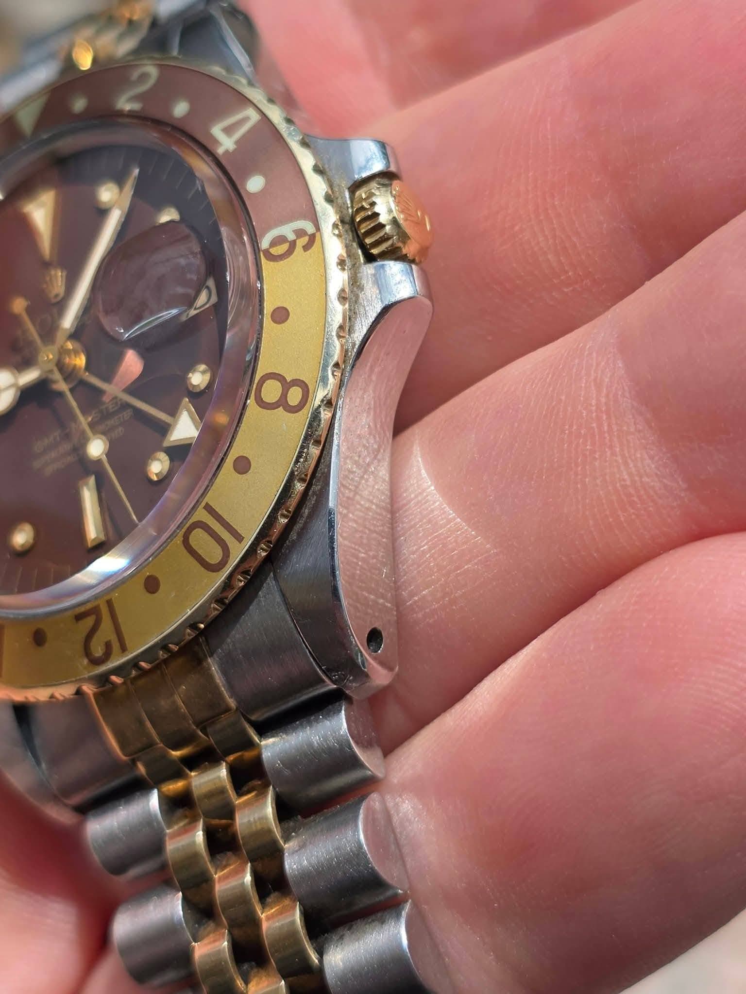May be an image of wrist watch and text