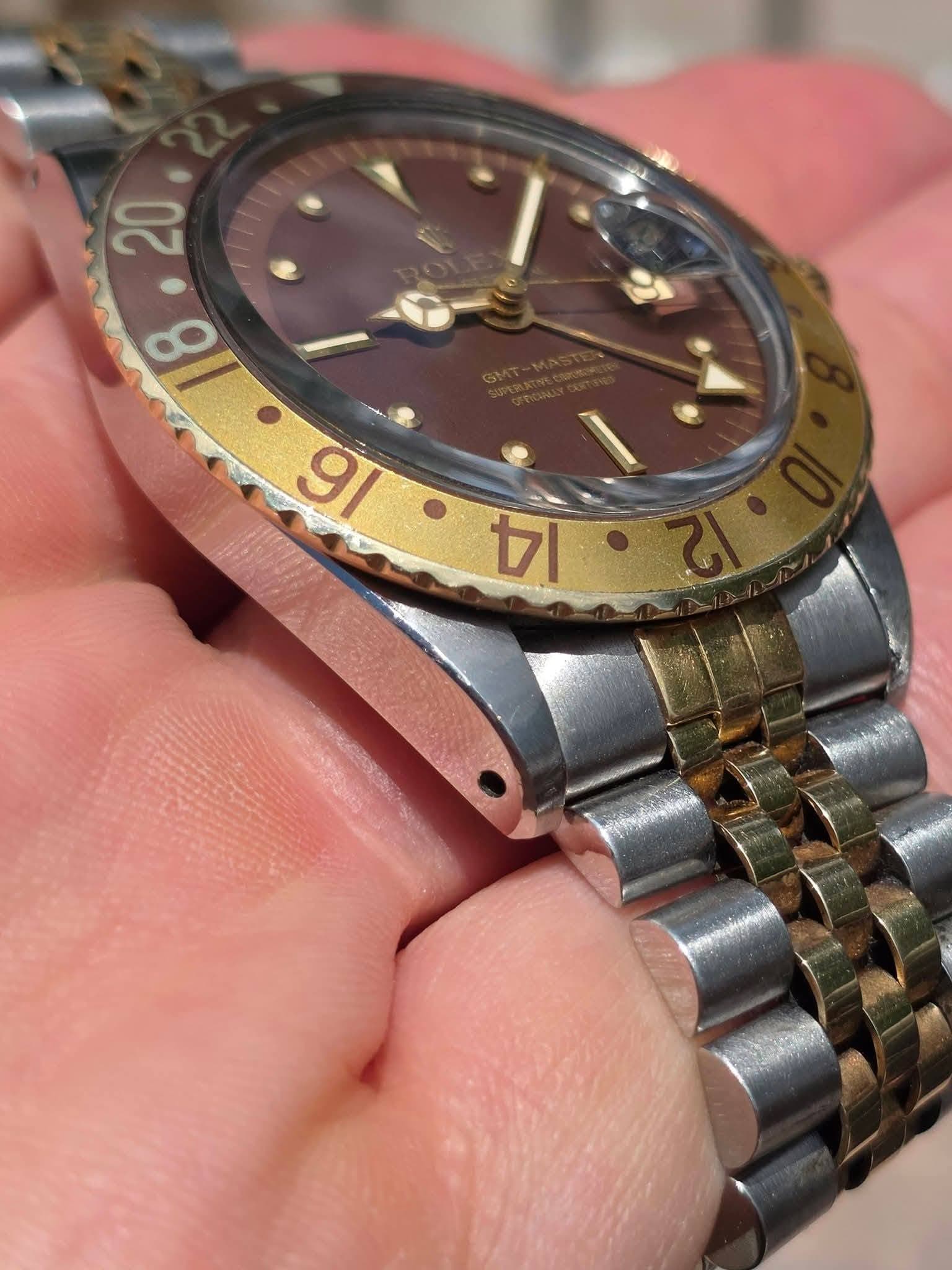 May be an image of wrist watch and text
