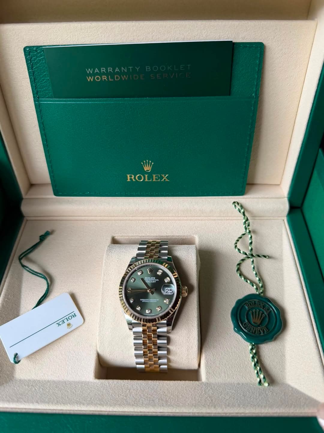 May be an image of wrist watch and text