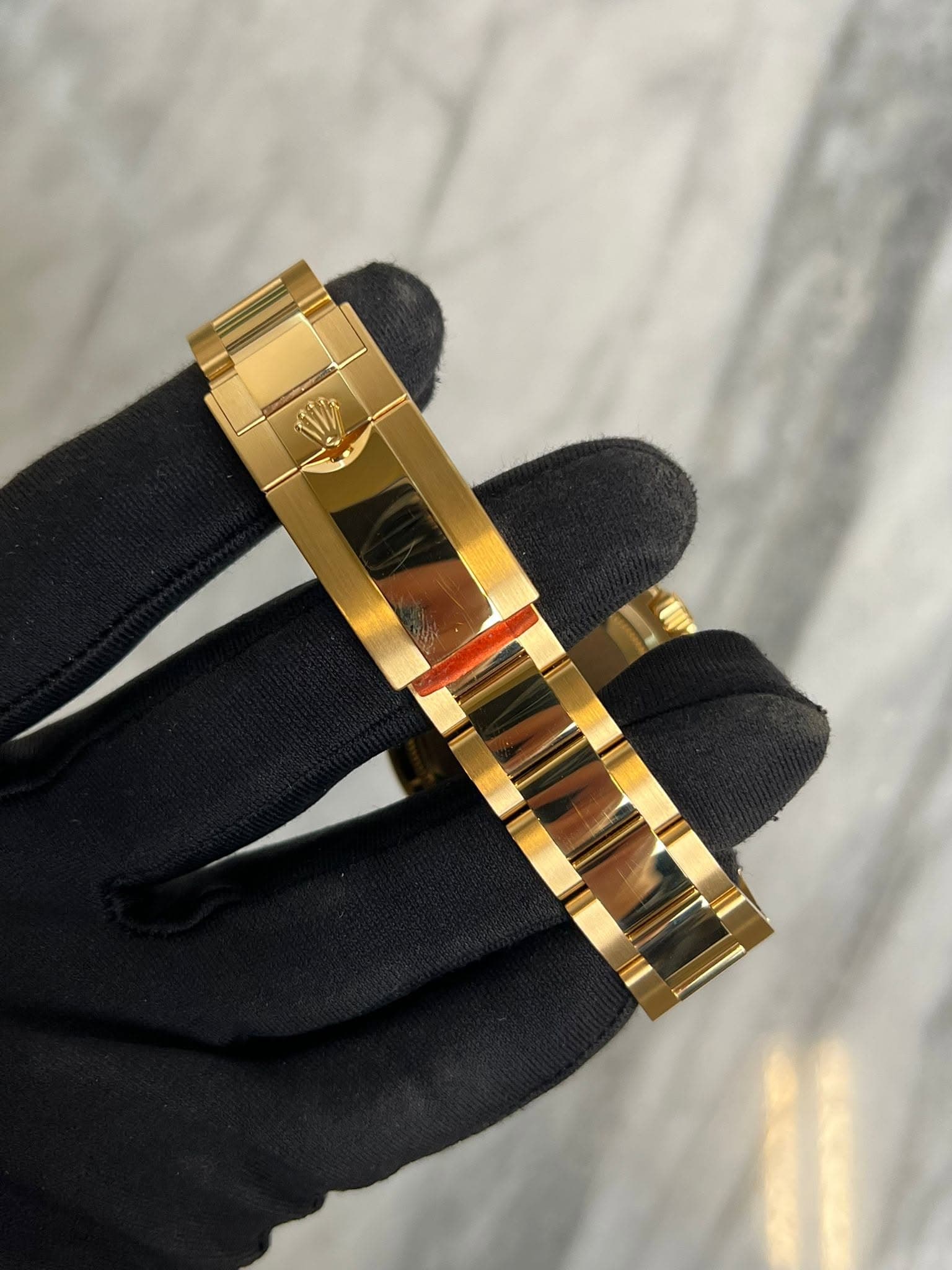 May be an image of wrist watch and jewelry
