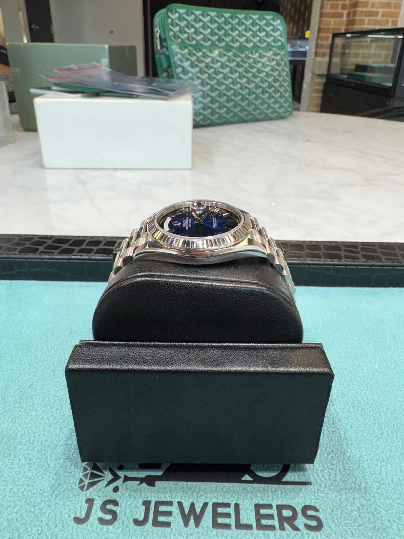 May be an image of wrist watch, ring and text that says 'JS JEWELERS'