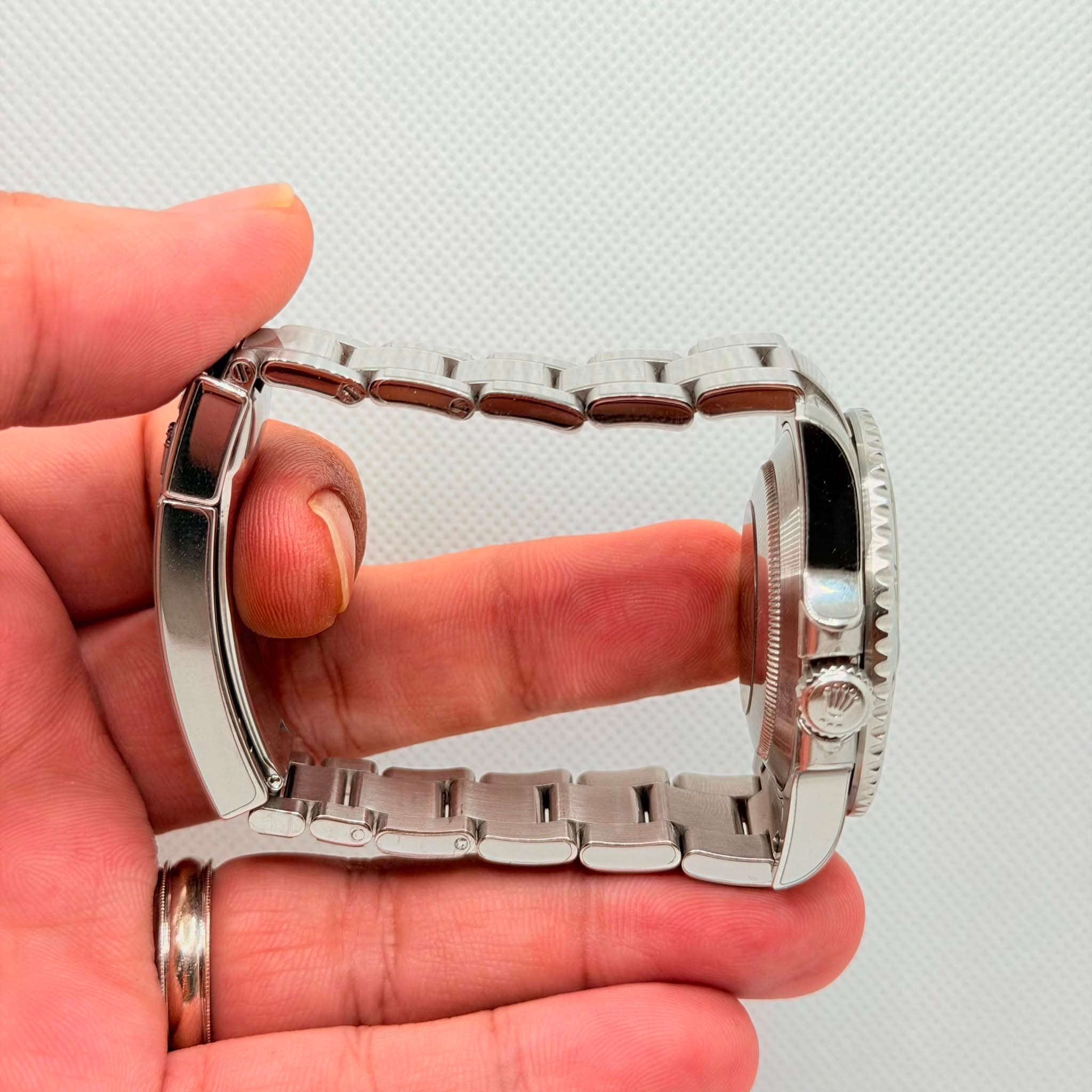 May be an image of wrist watch and jewelry