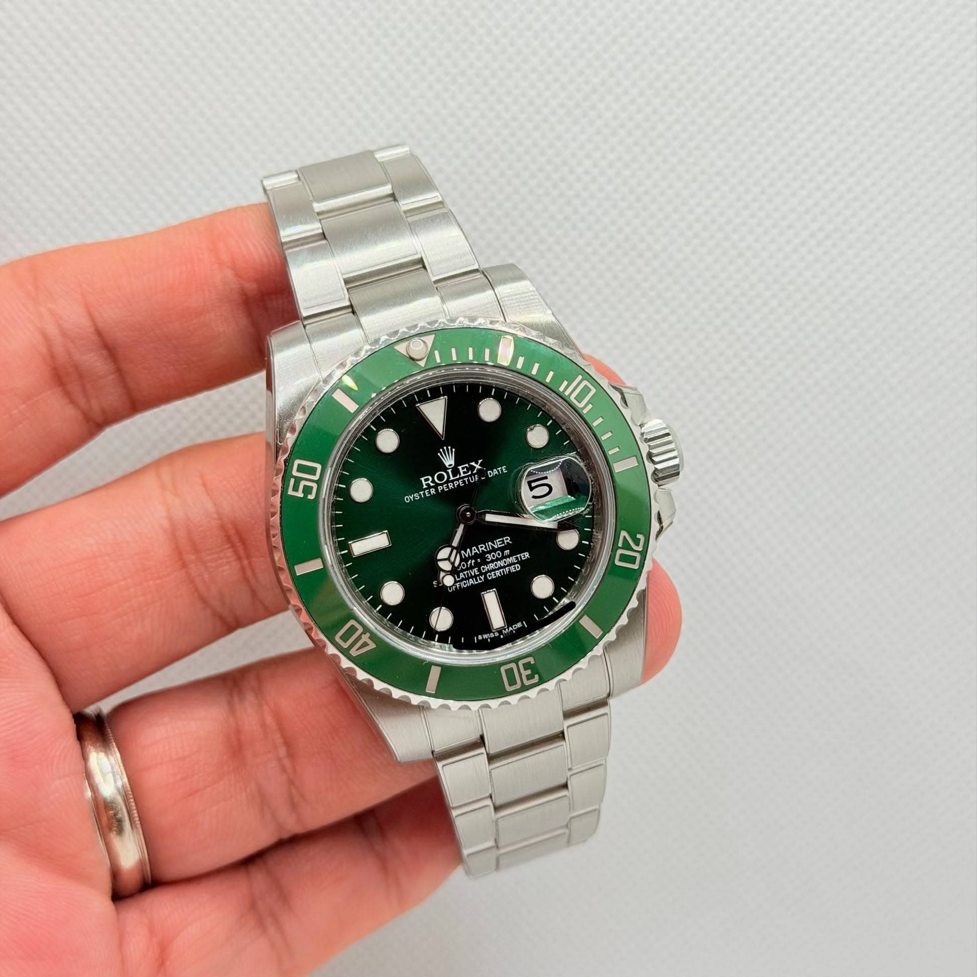 May be an image of wrist watch and text