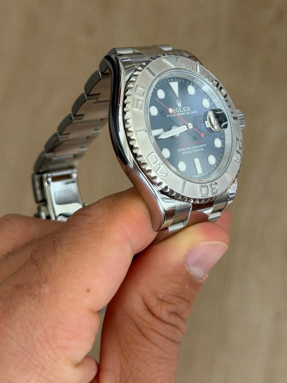 May be an image of wrist watch and text