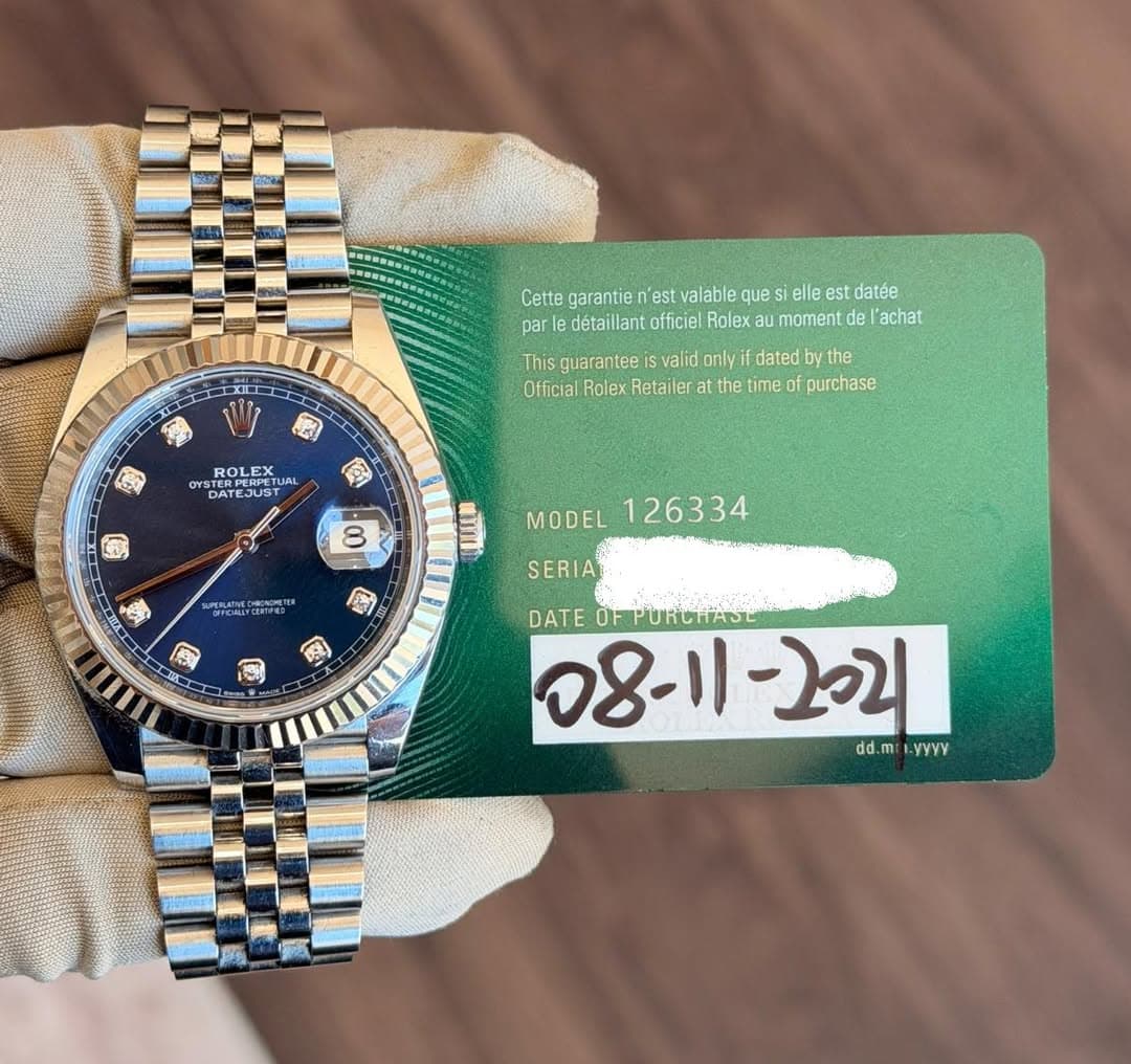 May be an image of wrist watch and text that says 'Cette garantie 'est valable que es elle est est datée détaillanto officiel Rolex aul au moment de 'achat XI0 エエエ 2 क This…