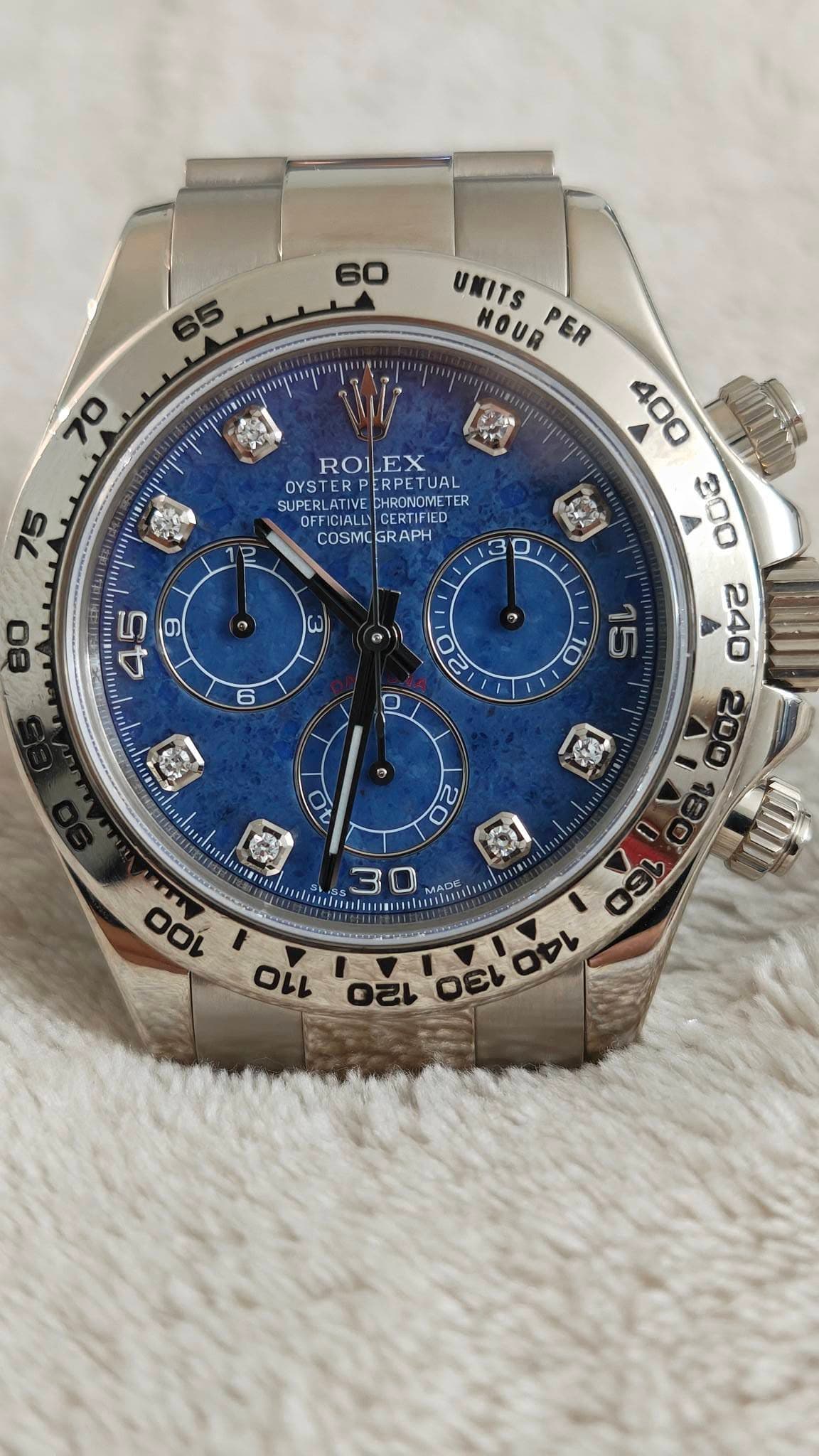 May be an image of wrist watch and text