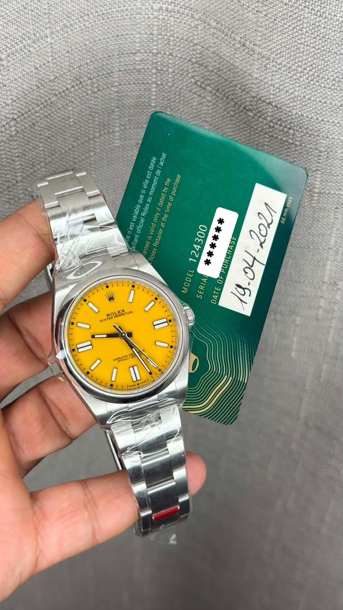 May be an image of digital watch and text that says 'achur mament moment dresye purcase Gabieq que Balay Rolex Retanler 124300 ****** PURCHASE ្លាំ់ AAA o MODEL SERIAU DATE 19.04…