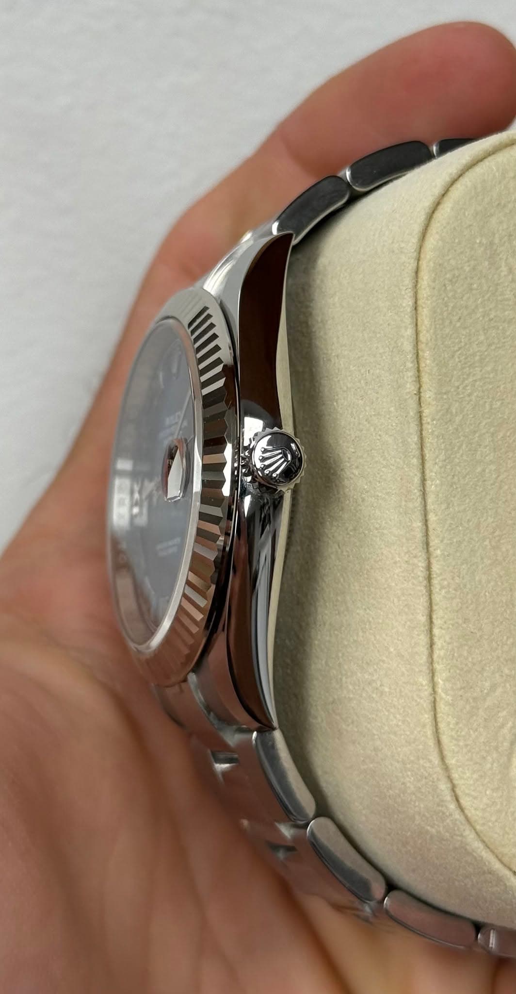 May be an image of wrist watch and text