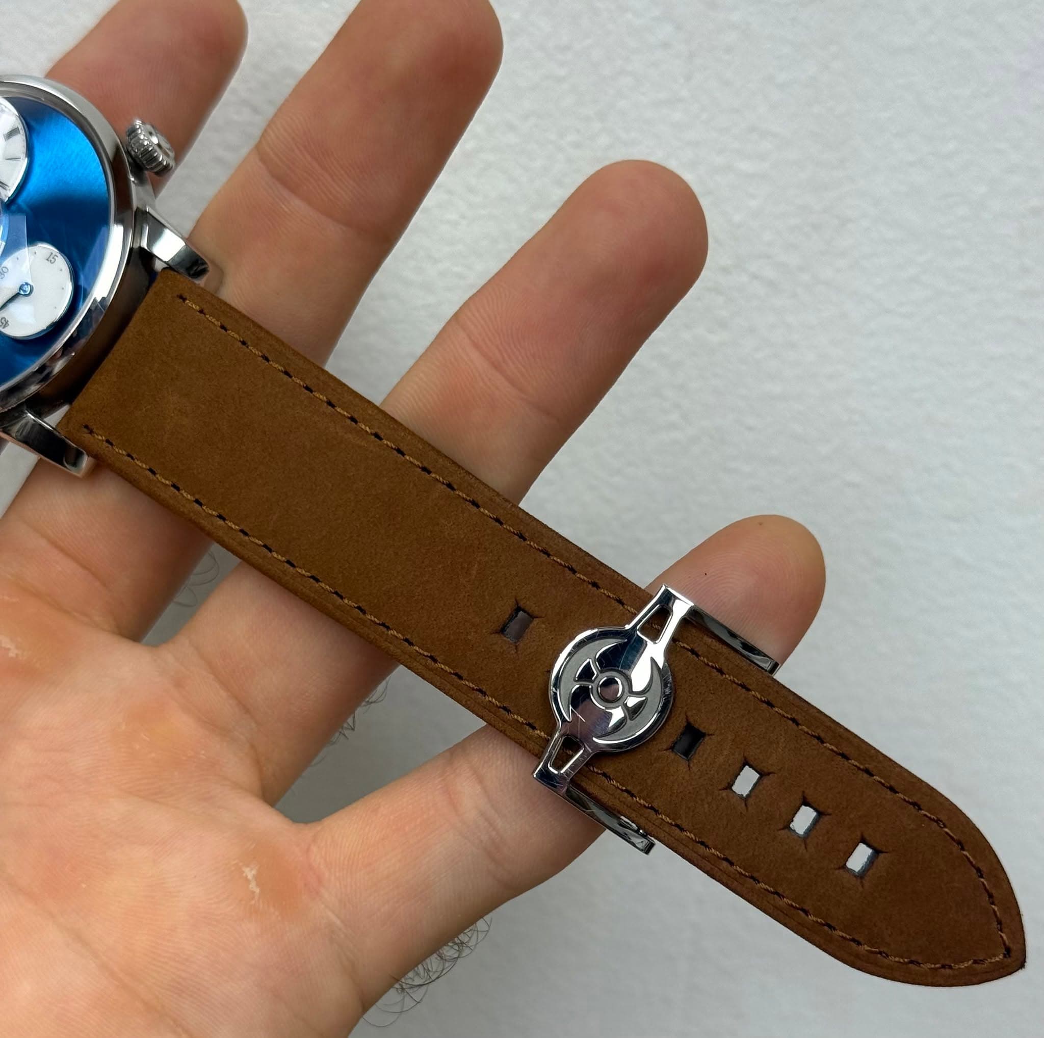 May be an image of wrist watch and text