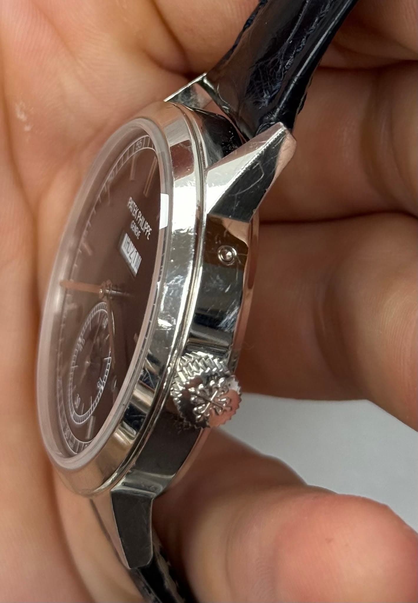 May be an image of wrist watch and text