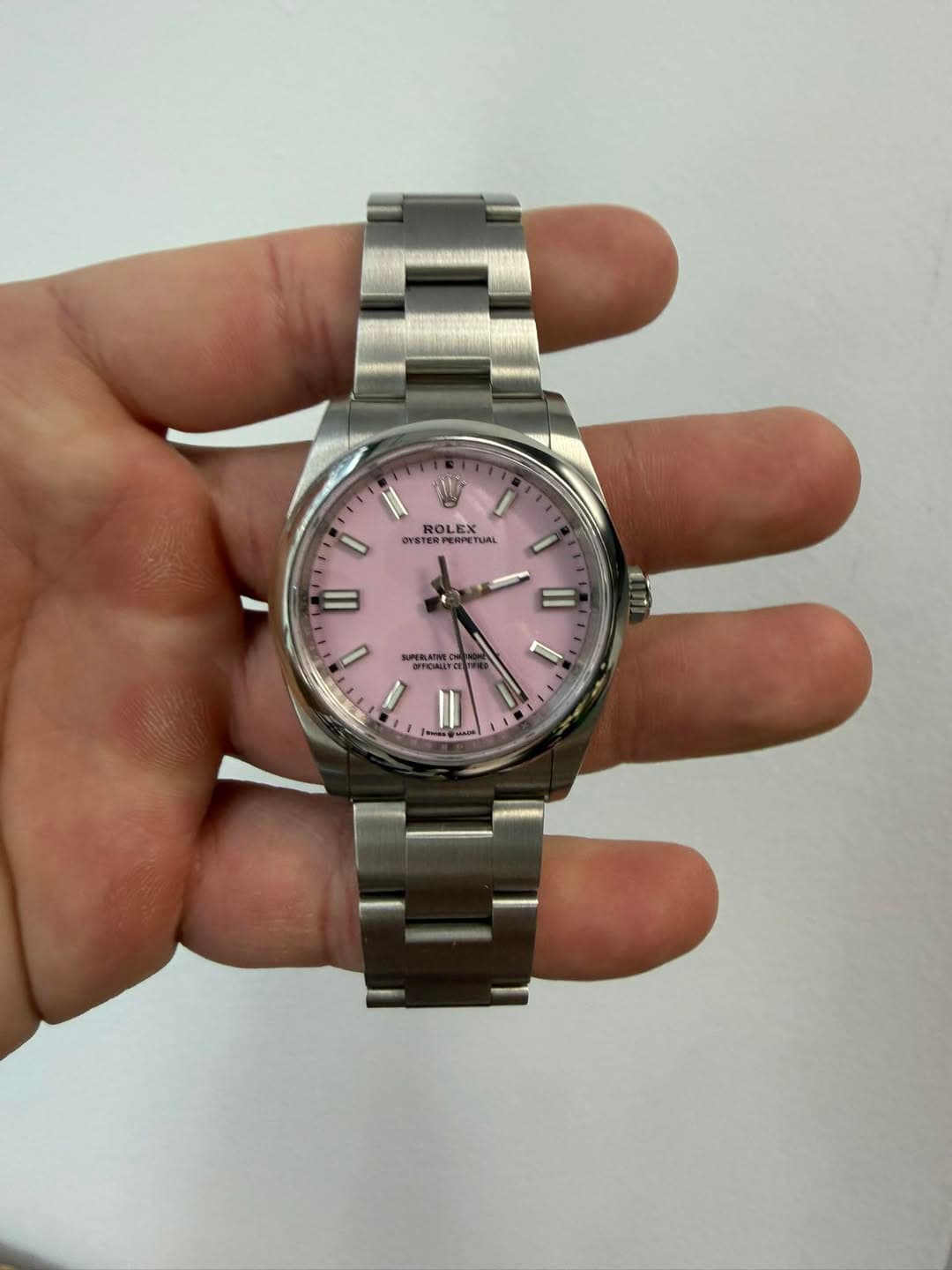 May be an image of wrist watch and text