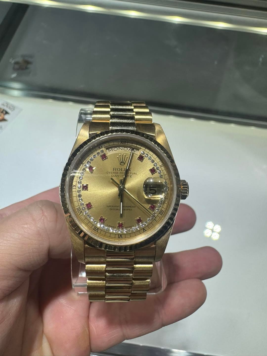 May be an image of wrist watch and text