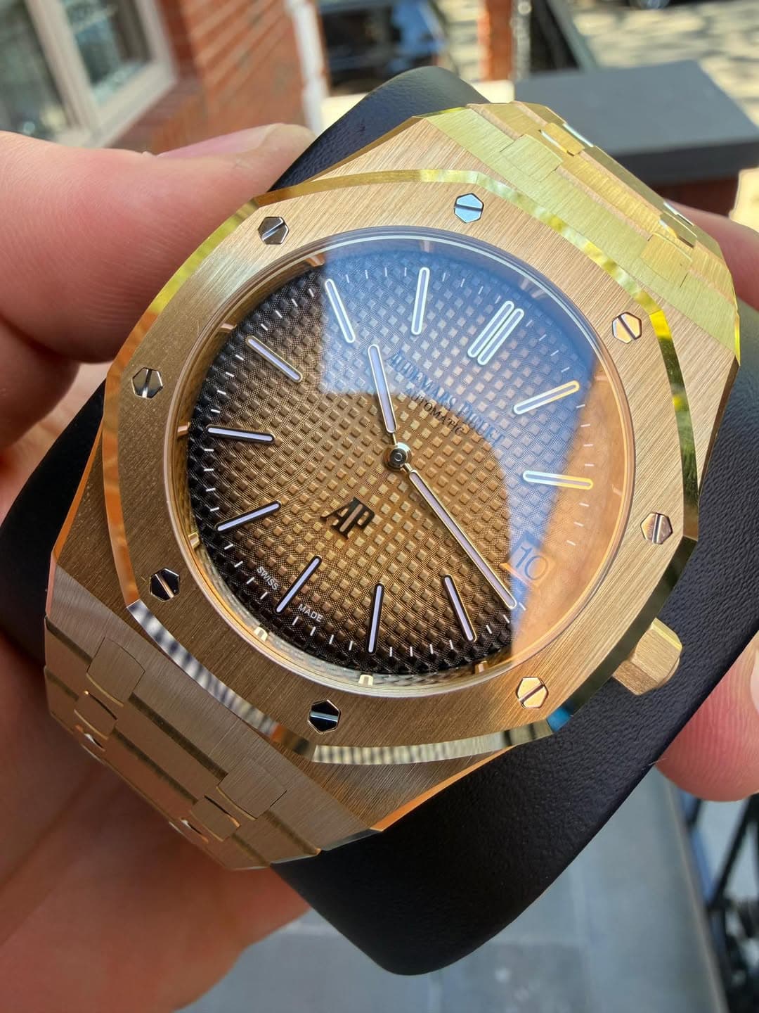 May be an image of wrist watch and text