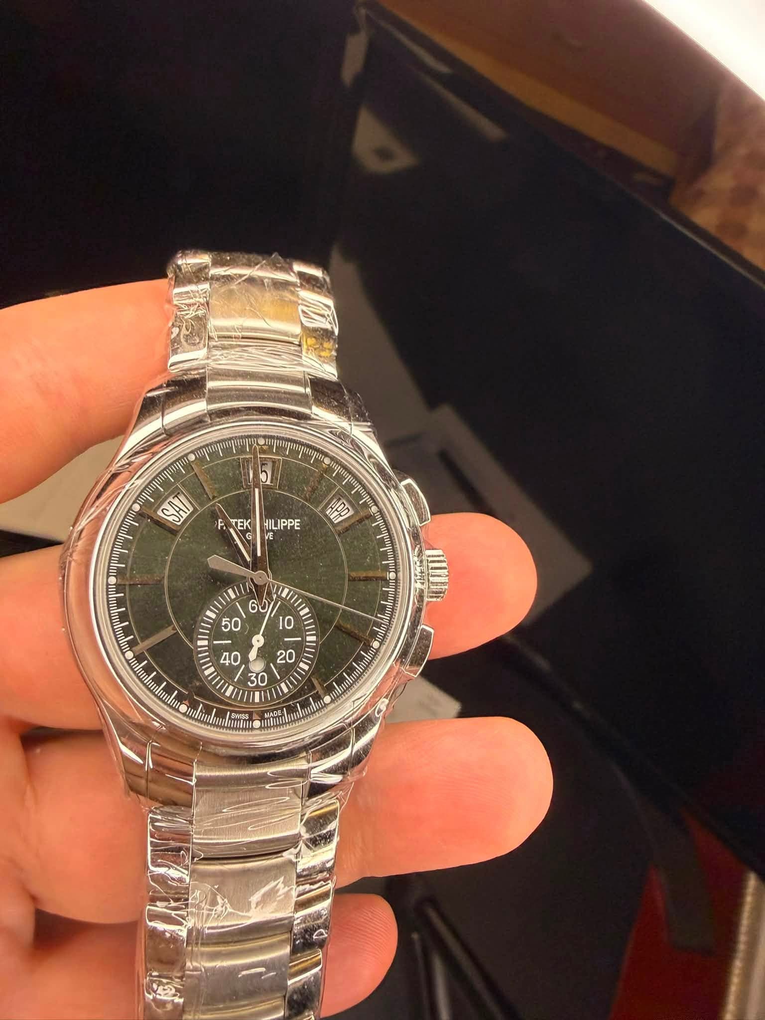 May be an image of wrist watch and text