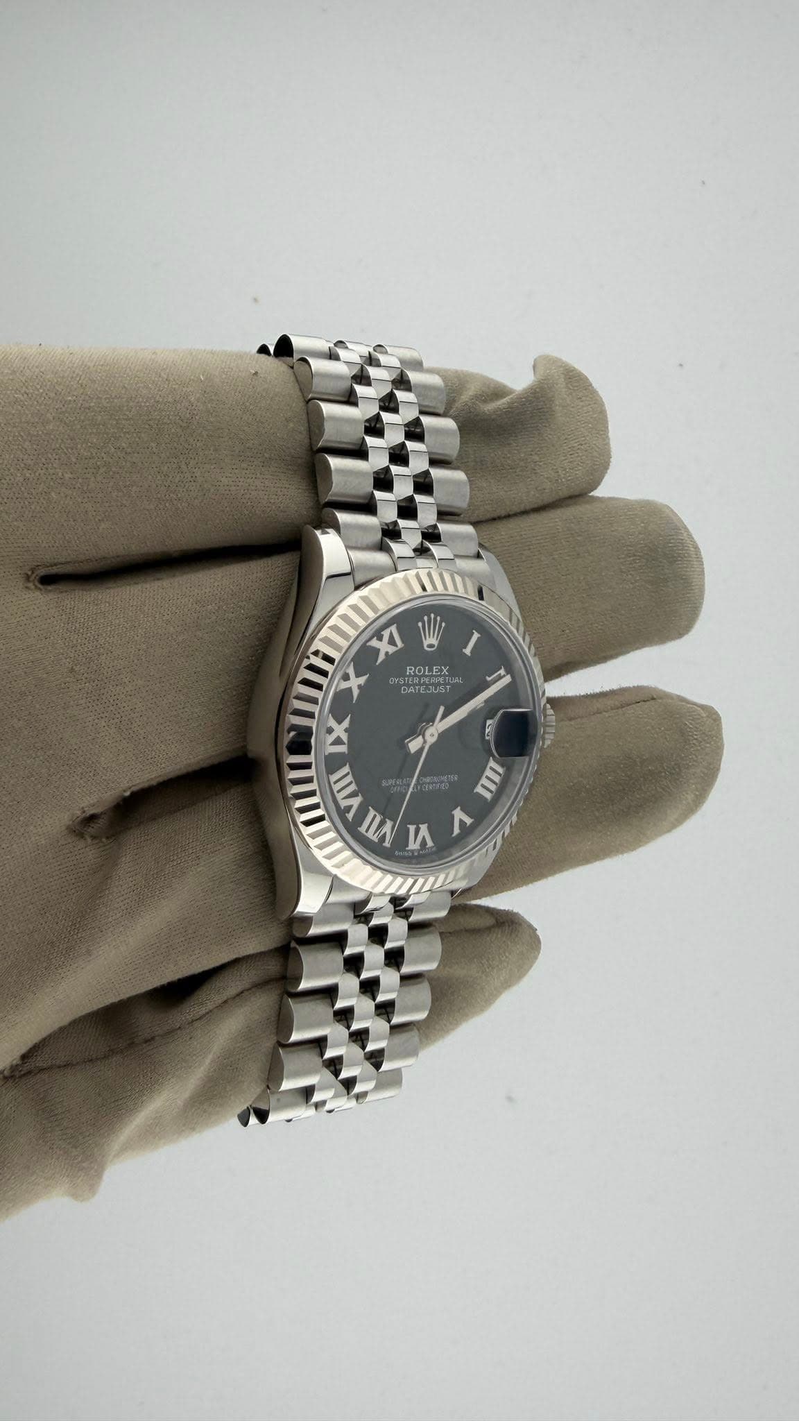May be an image of wrist watch and text